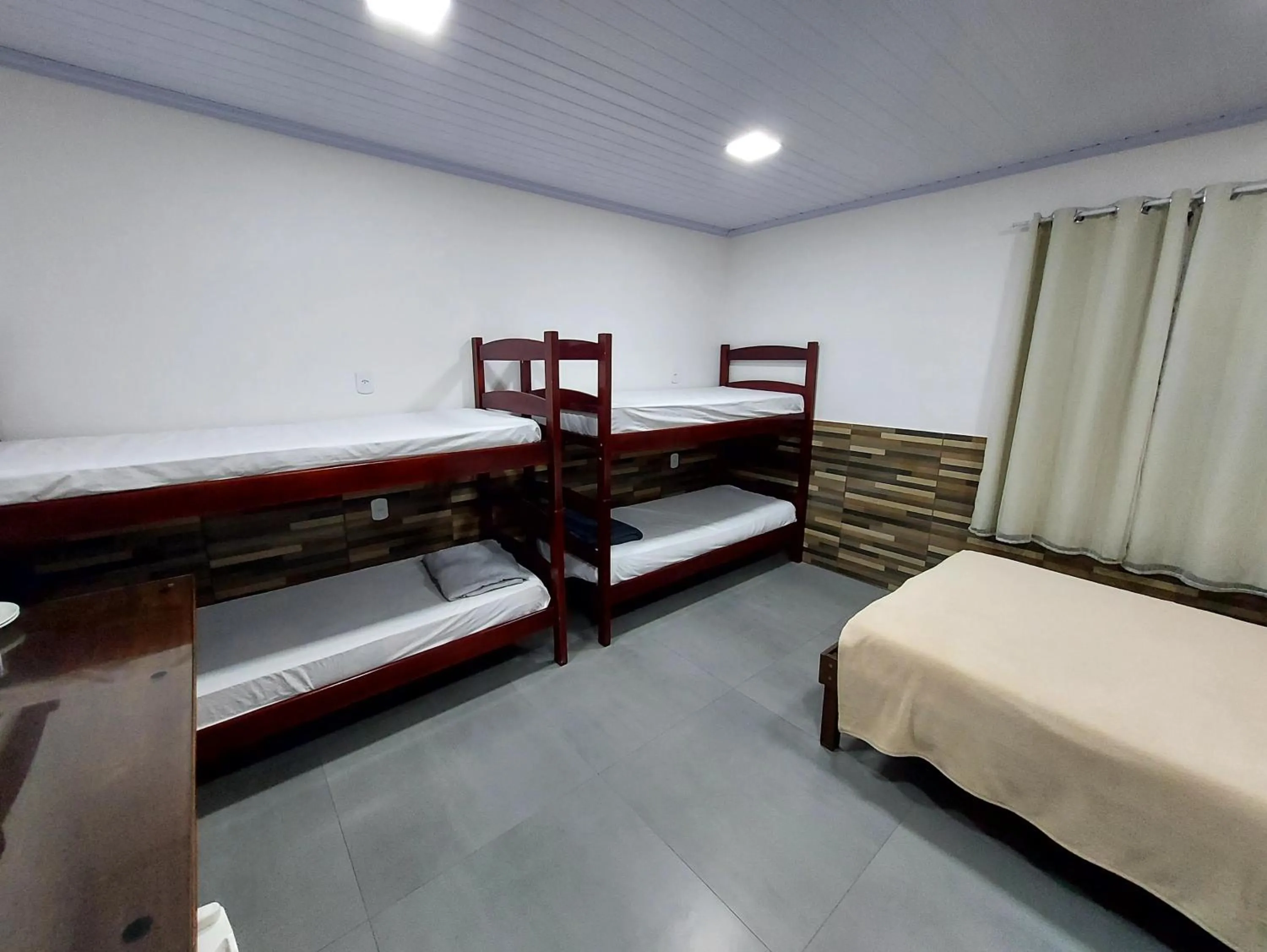 Bed in Pousada do Leô