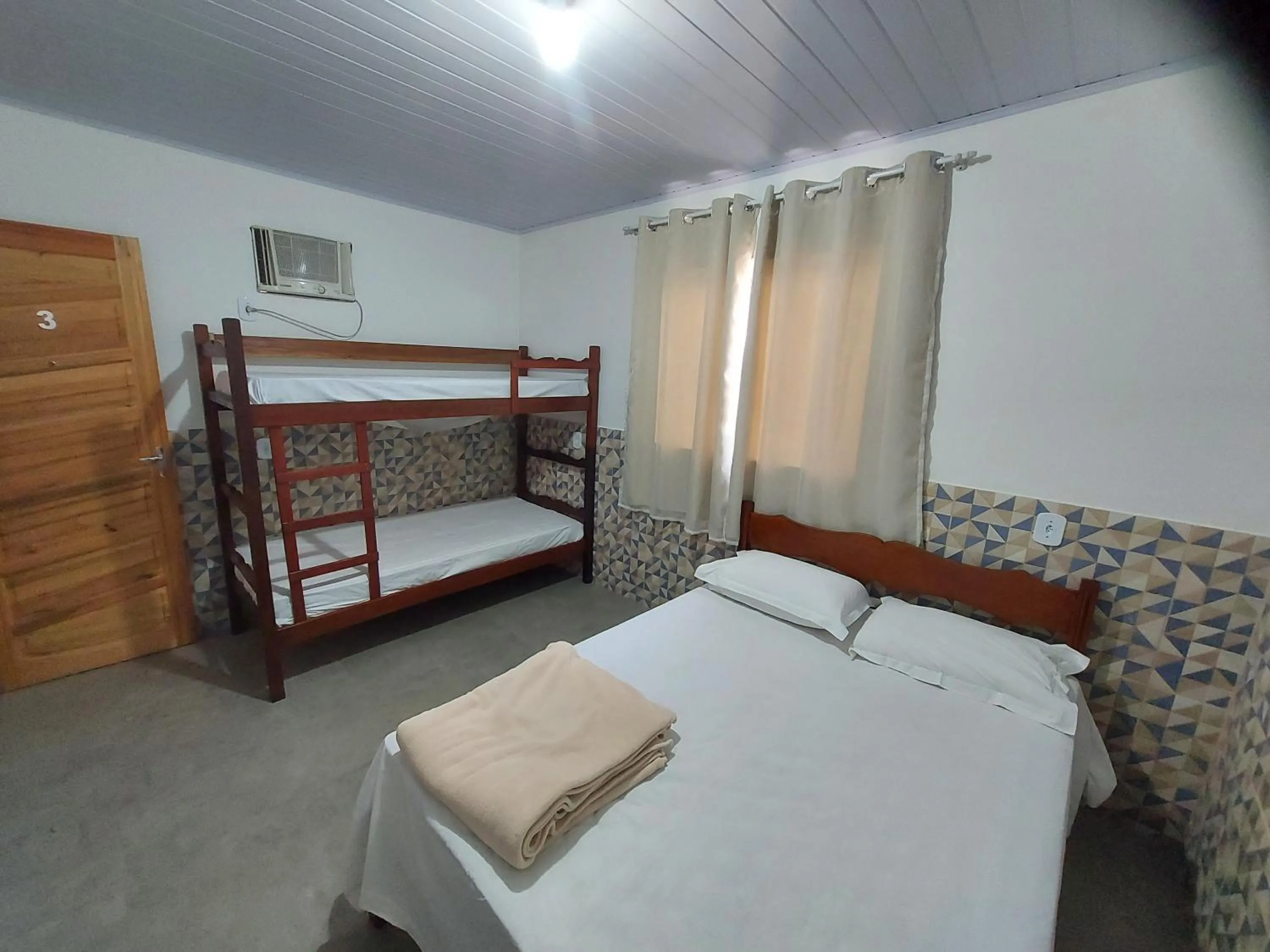Bed in Pousada do Leô