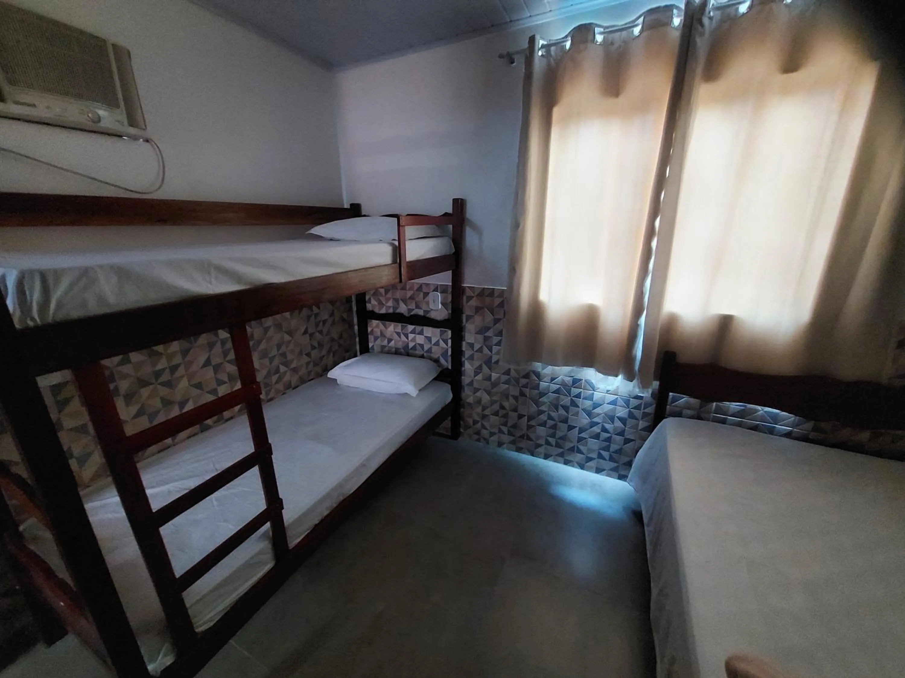 Bed in Pousada do Leô
