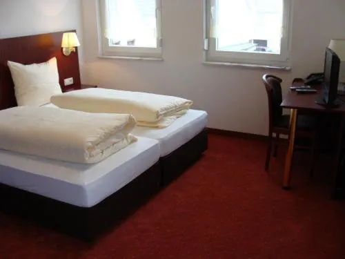 Photo of the whole room, Bed in Gasthaus Traube