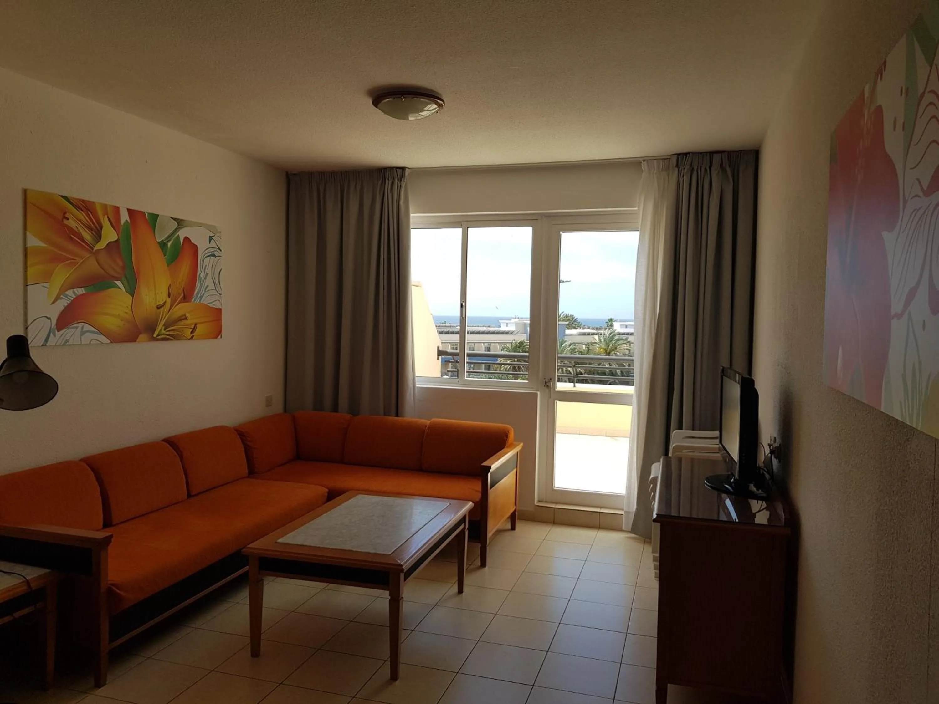 Living room in Apartamentos Palm Garden