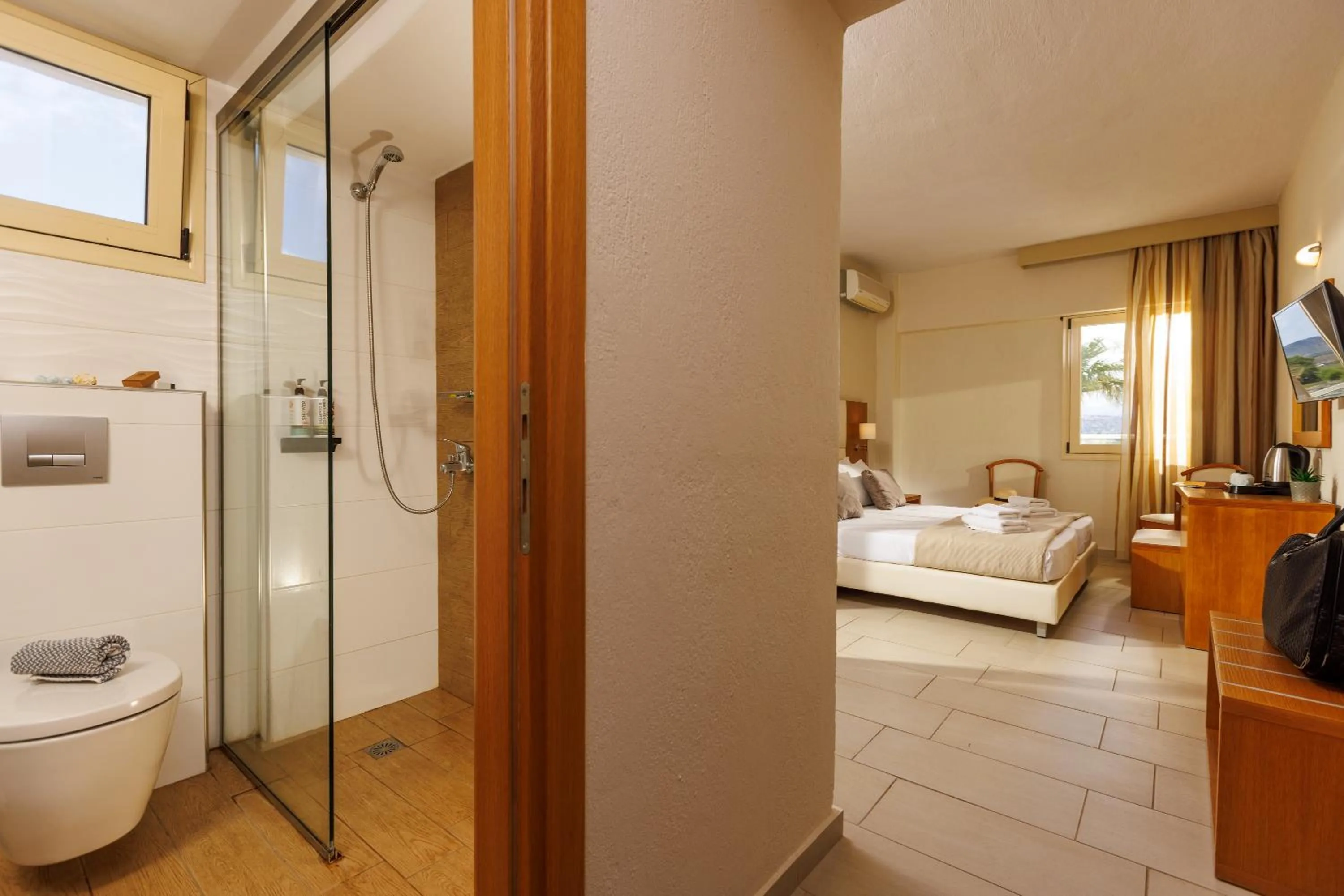 Toilet, Bed in Malia Bay Beach Hotel & Bungalows