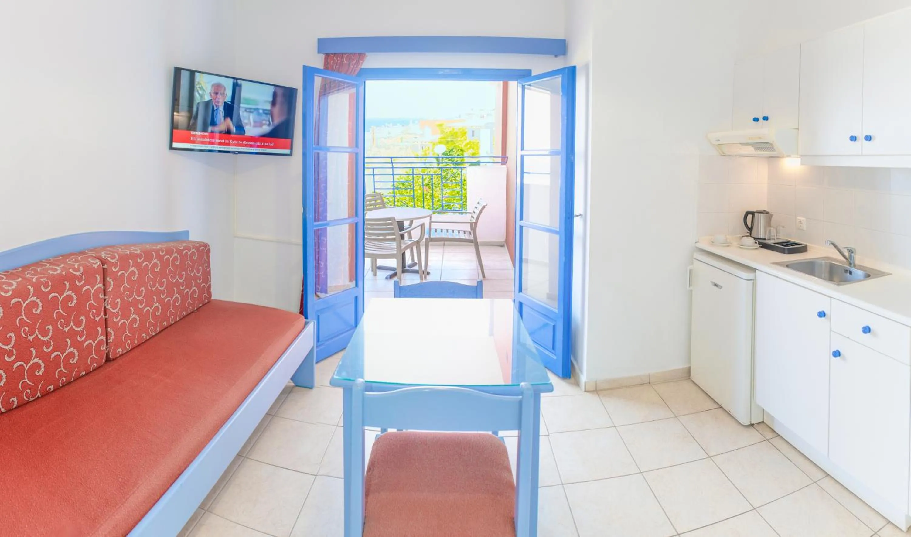 Bed in Astra Village & Suites