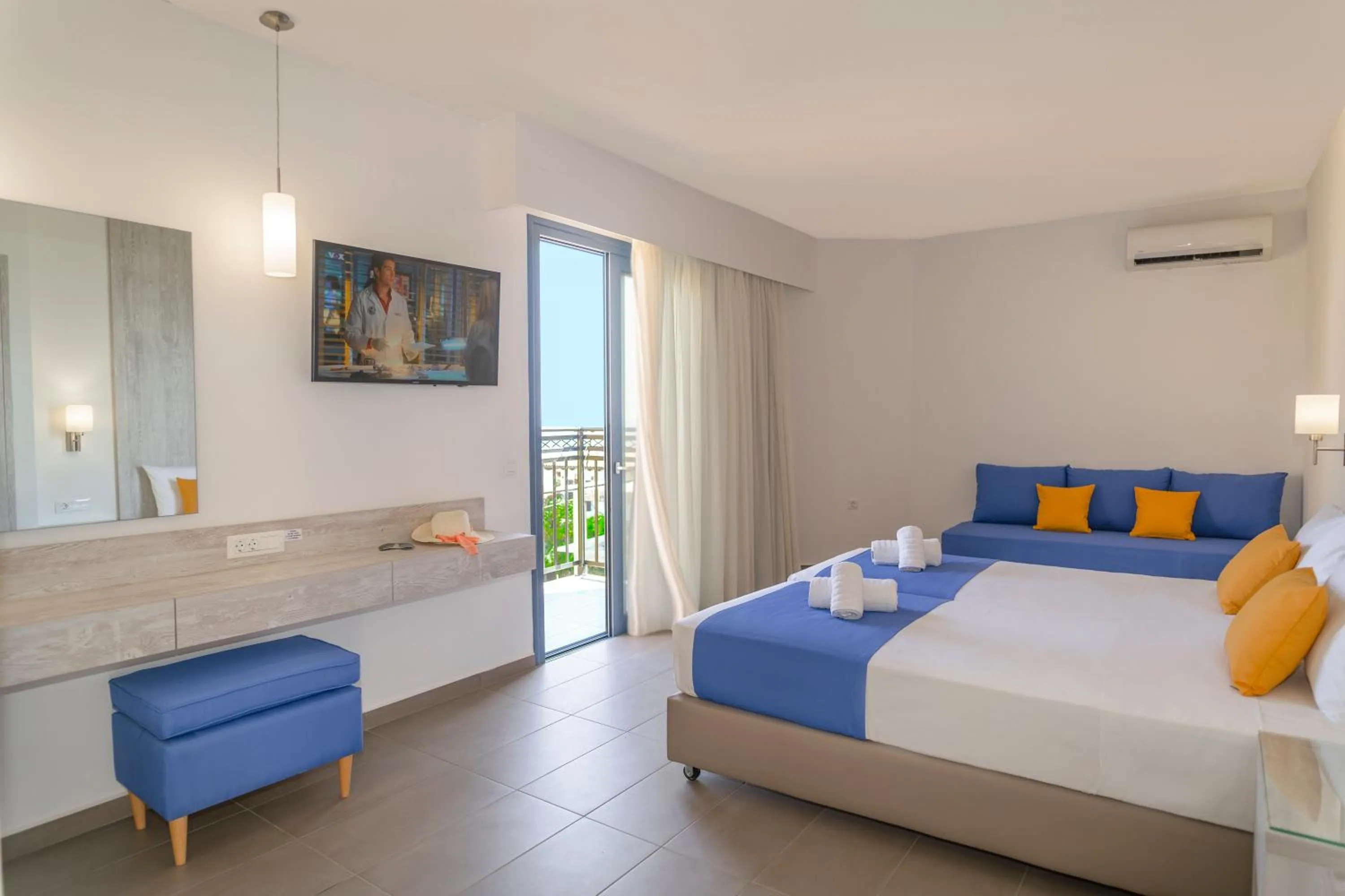 Bed in Astra Village & Suites