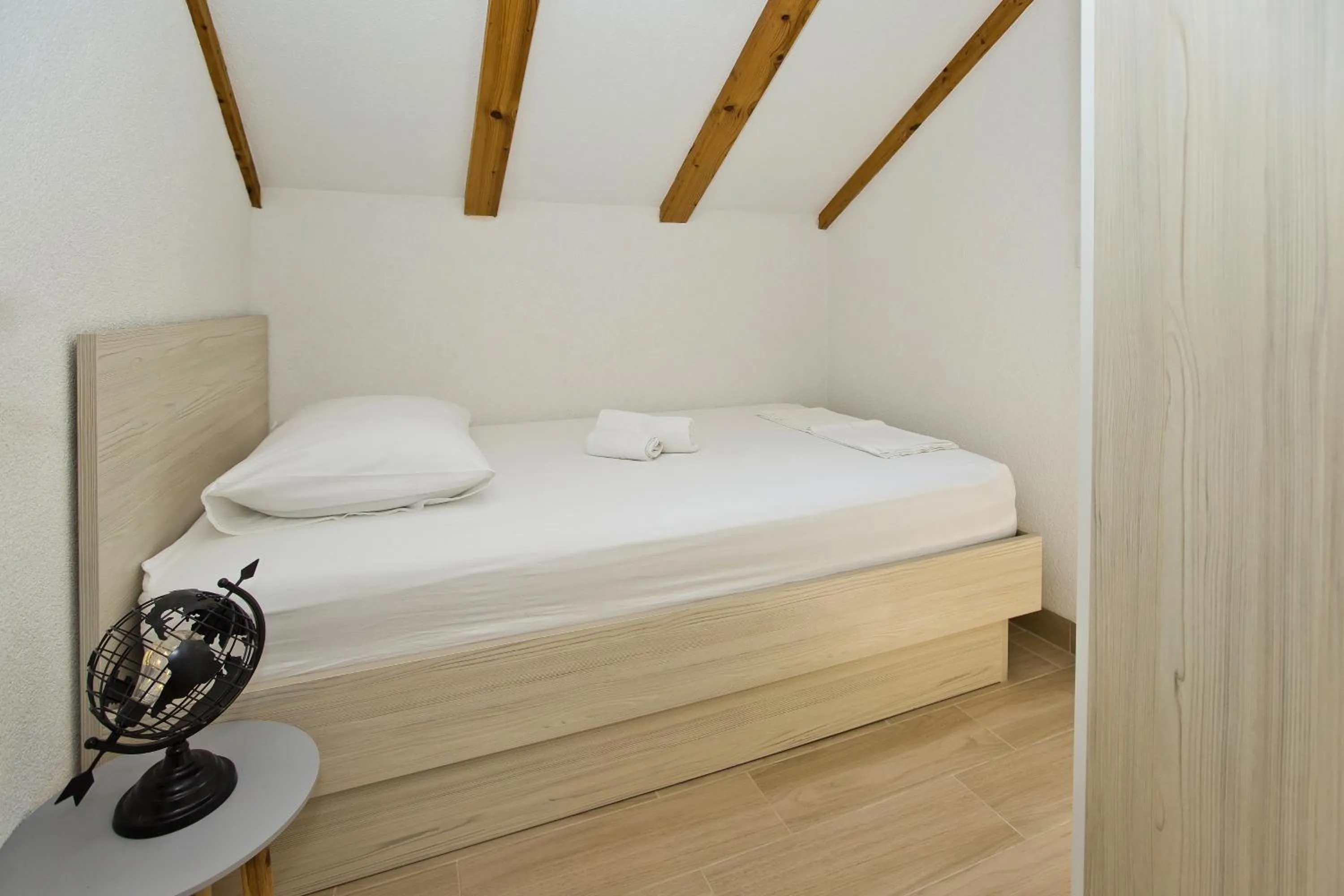 Bed in Apartments and Rooms Zvjezdana