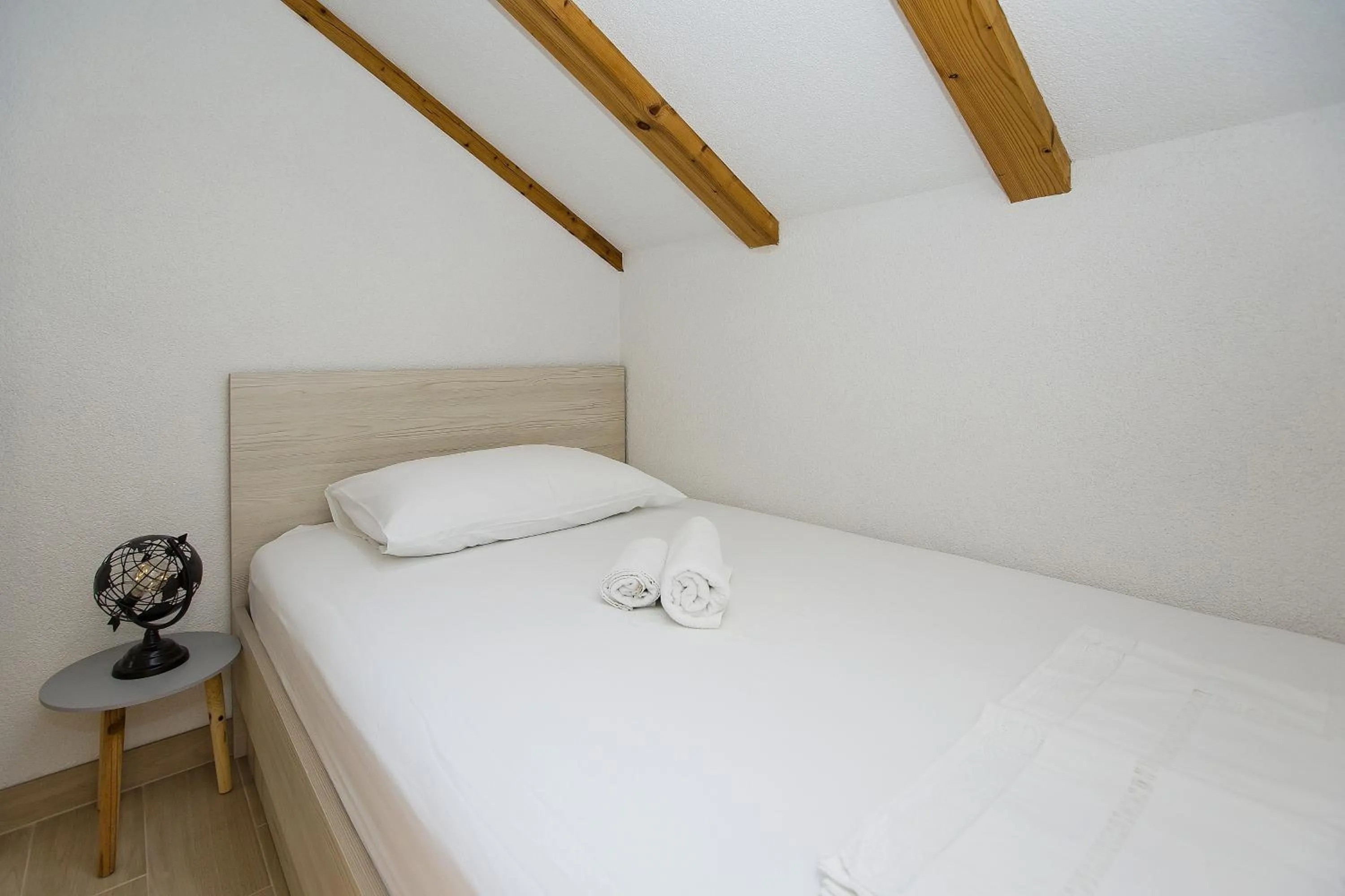 Bed in Apartments and Rooms Zvjezdana