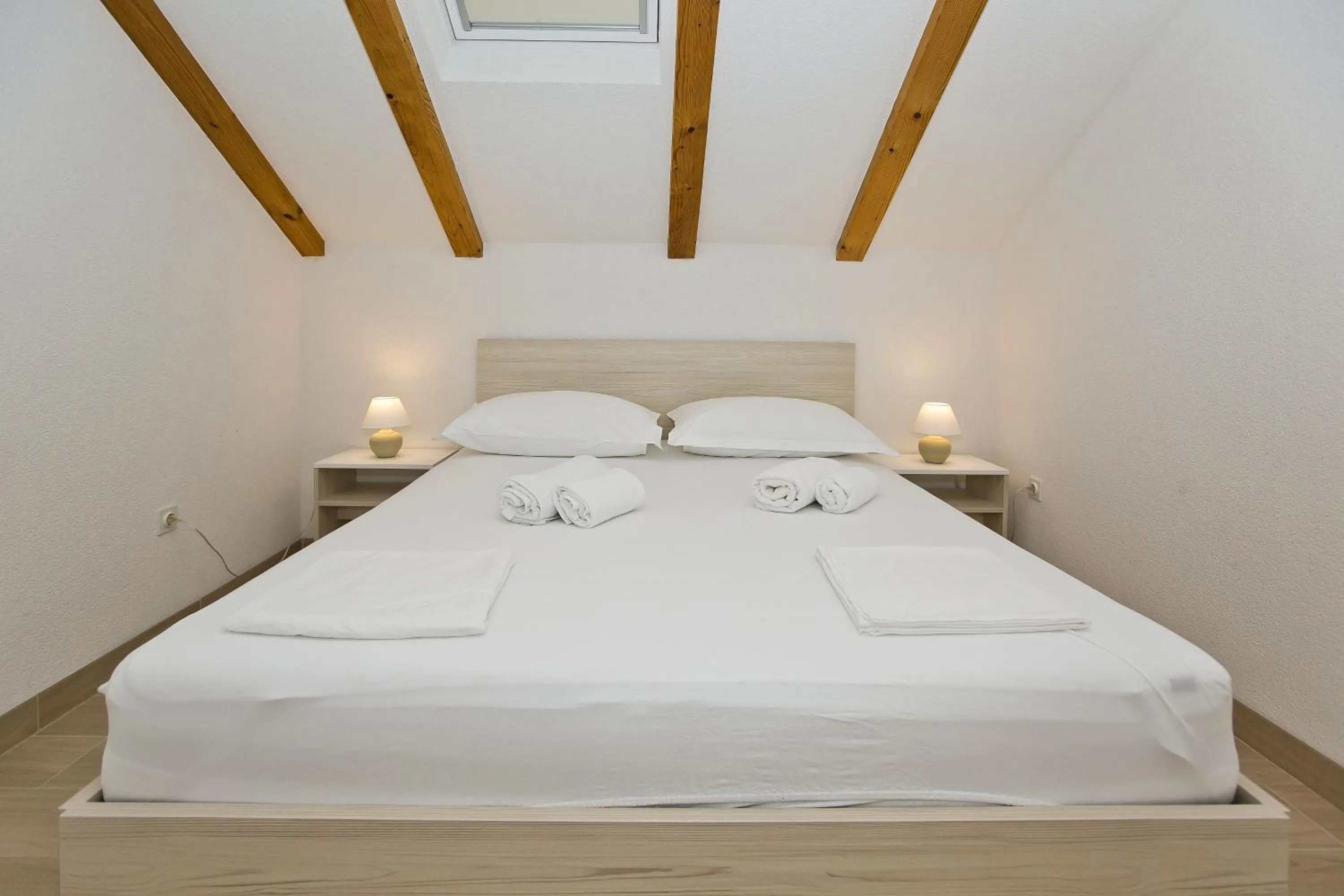 Bed in Apartments and Rooms Zvjezdana