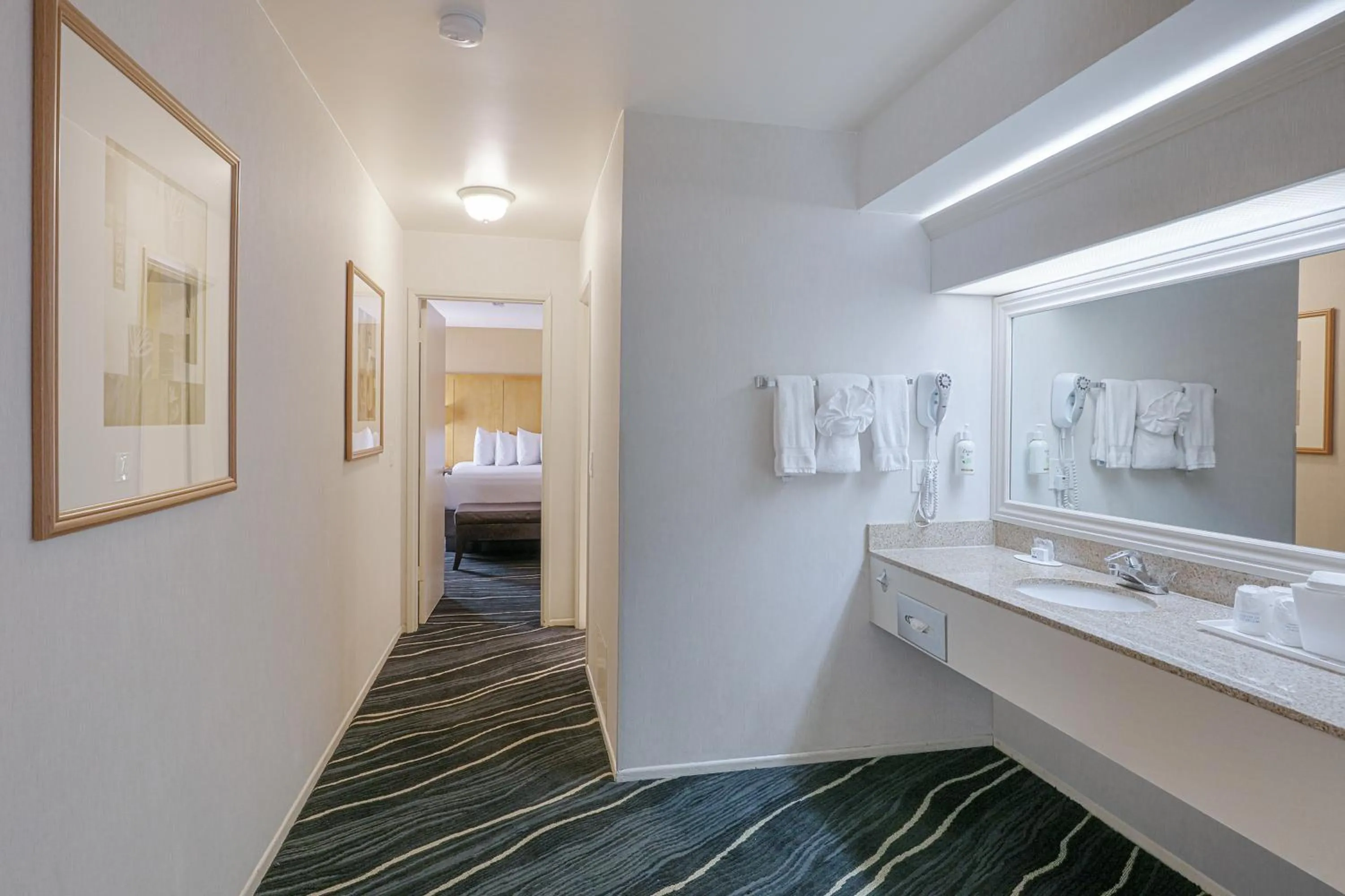 Bathroom, Bed in Ramada by Wyndham Costa Mesa/Newport Beach