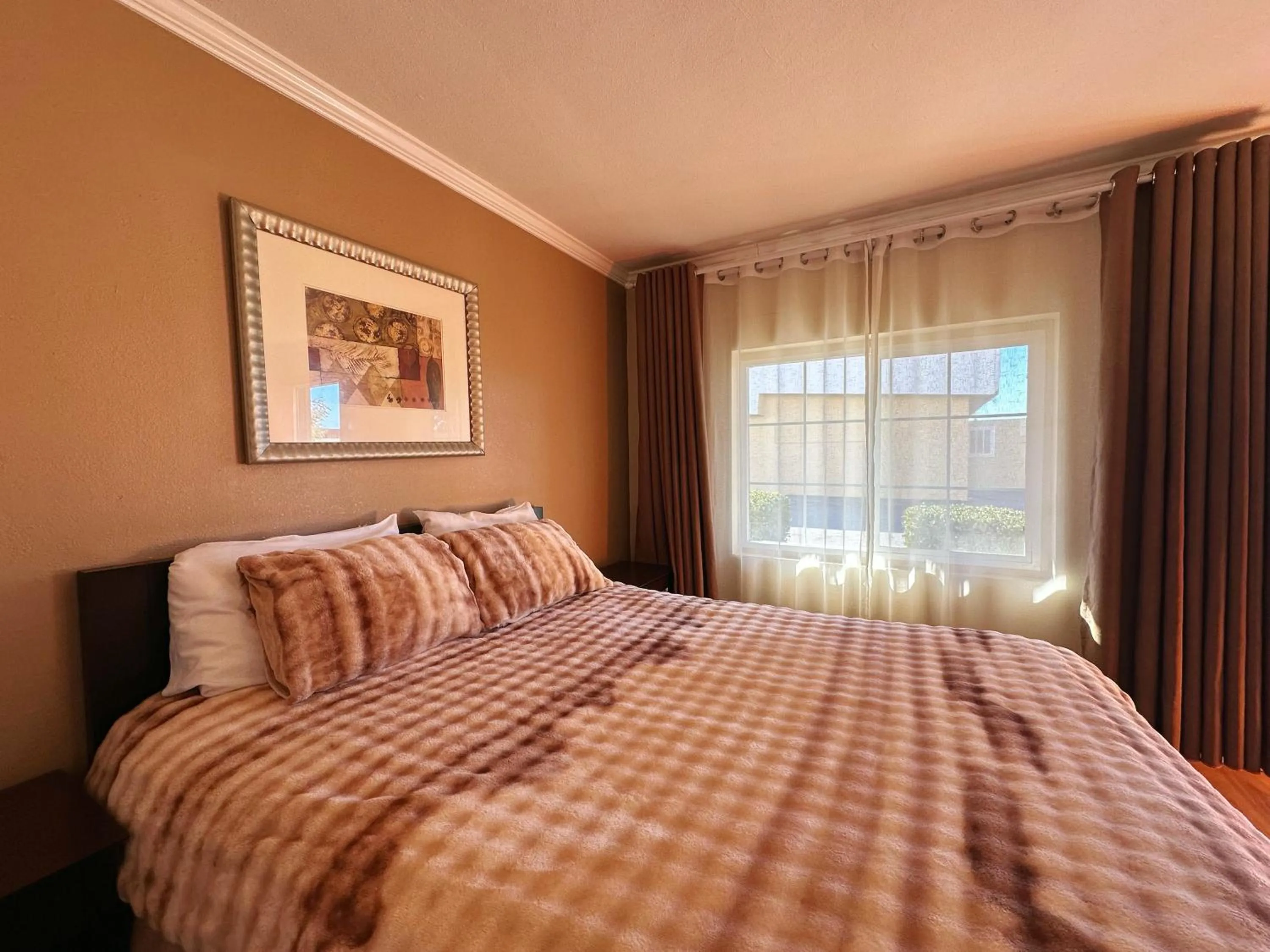 Bed in Royal Inn and Suites