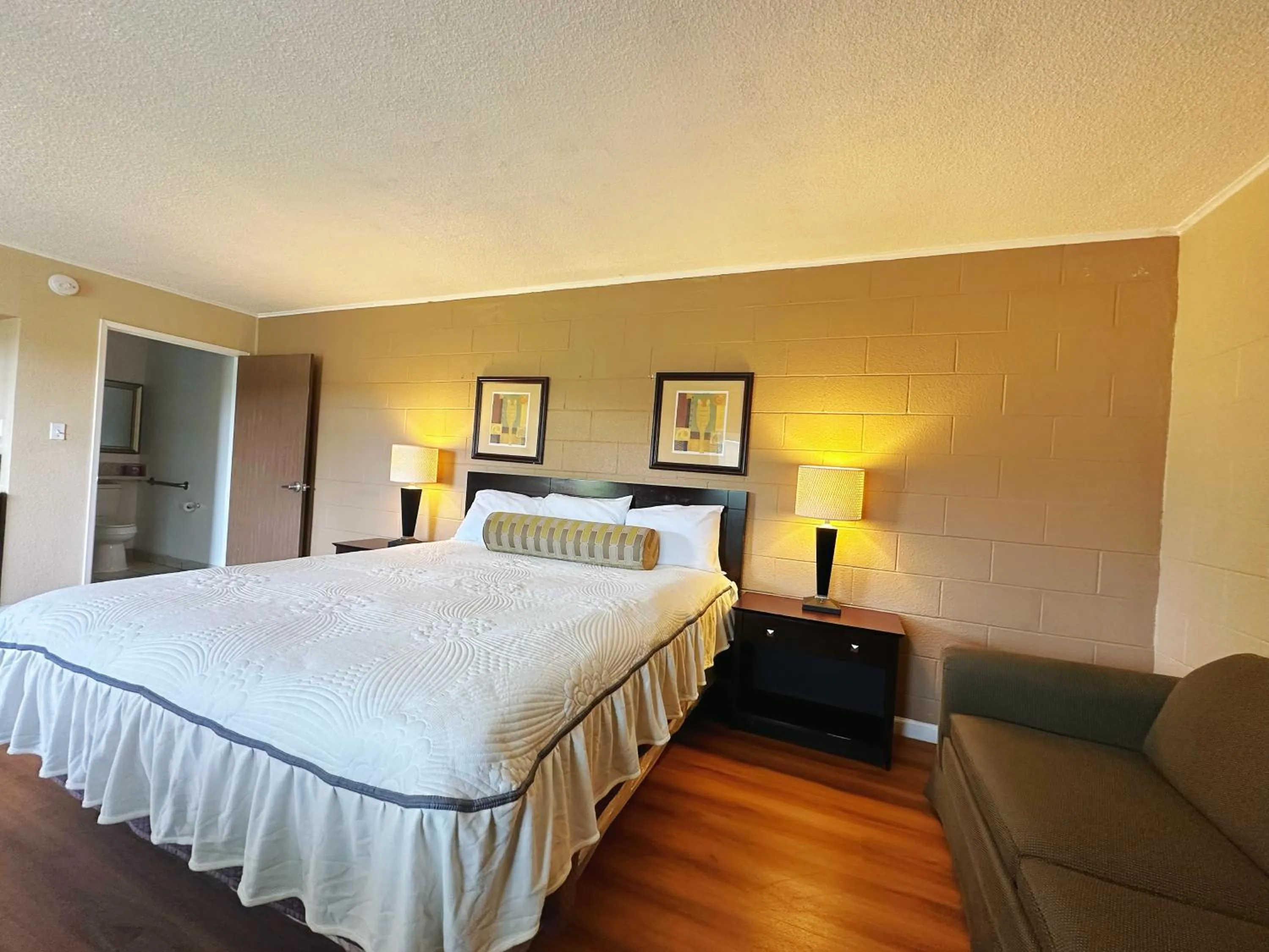 Bed in Royal Inn and Suites