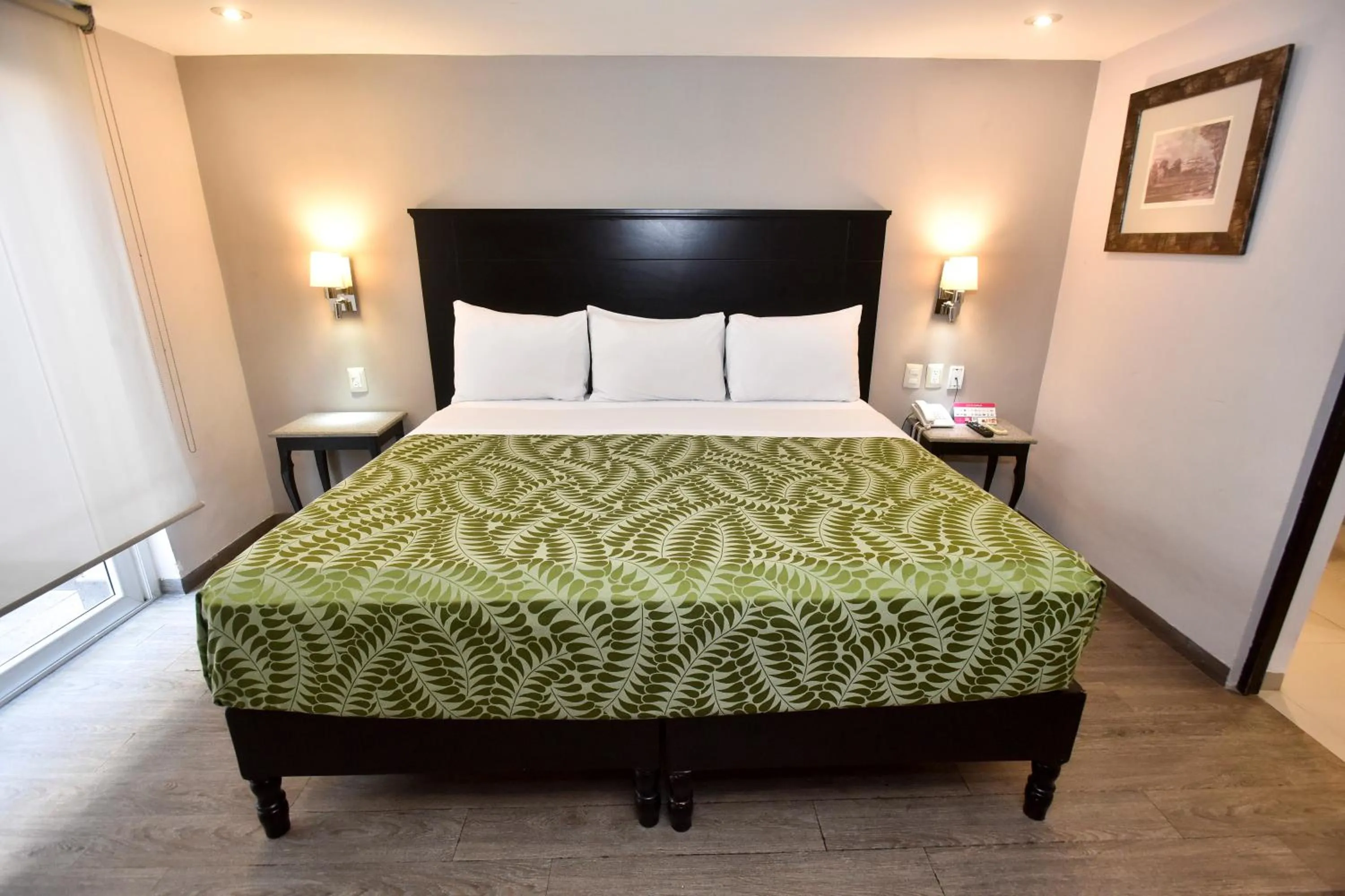 Bed in Plaza Camelinas Hotel