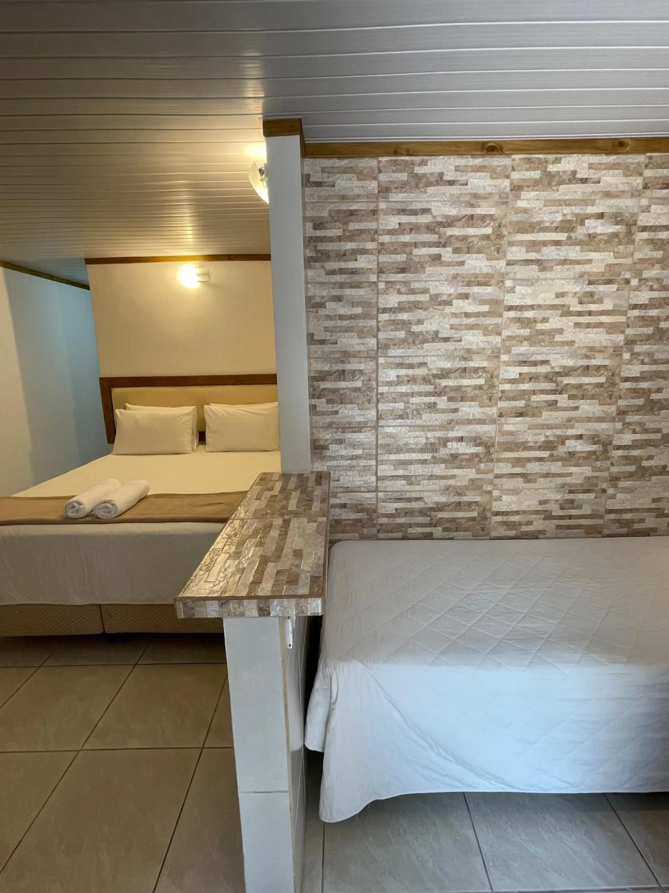 Bed in Pousada Ilha da Magia