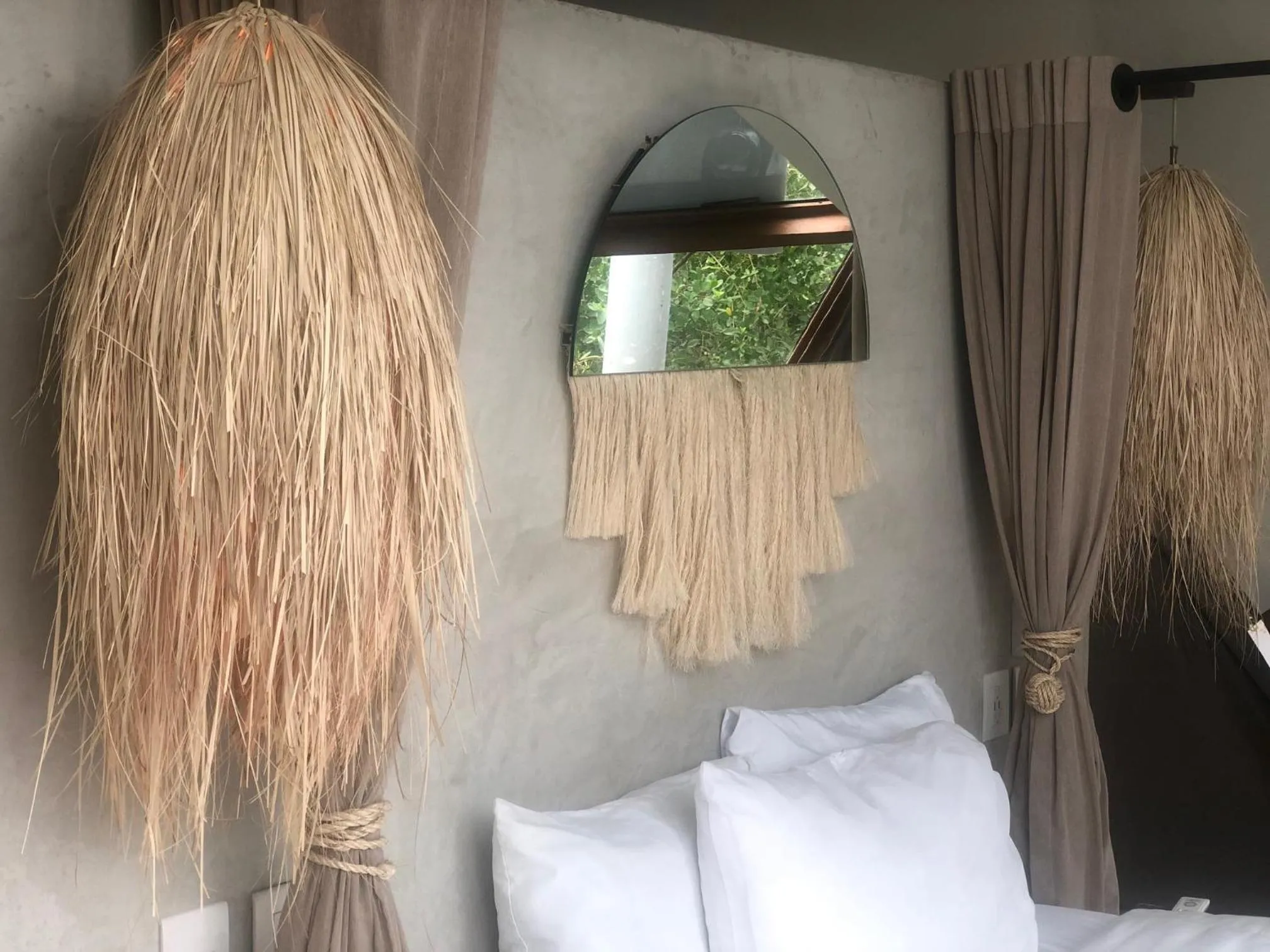 Bed in Mamasan Treehouses & Cabins