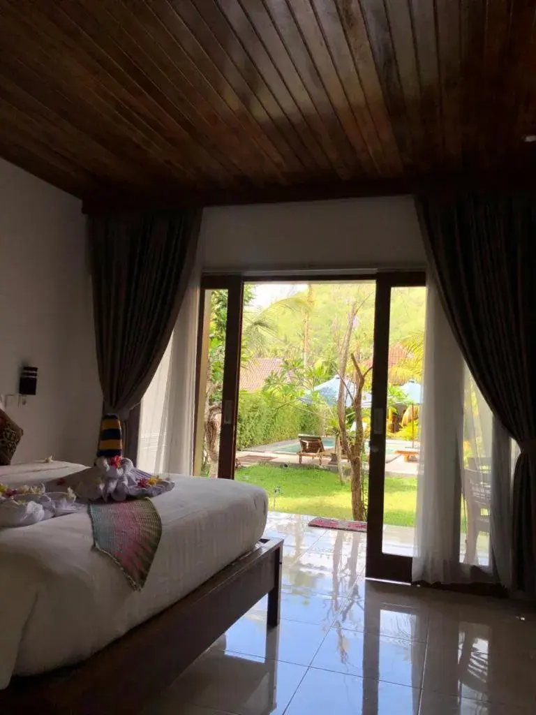 Bed in Crystal Bay Bungalows Bed in Crystal Bay Bungalows