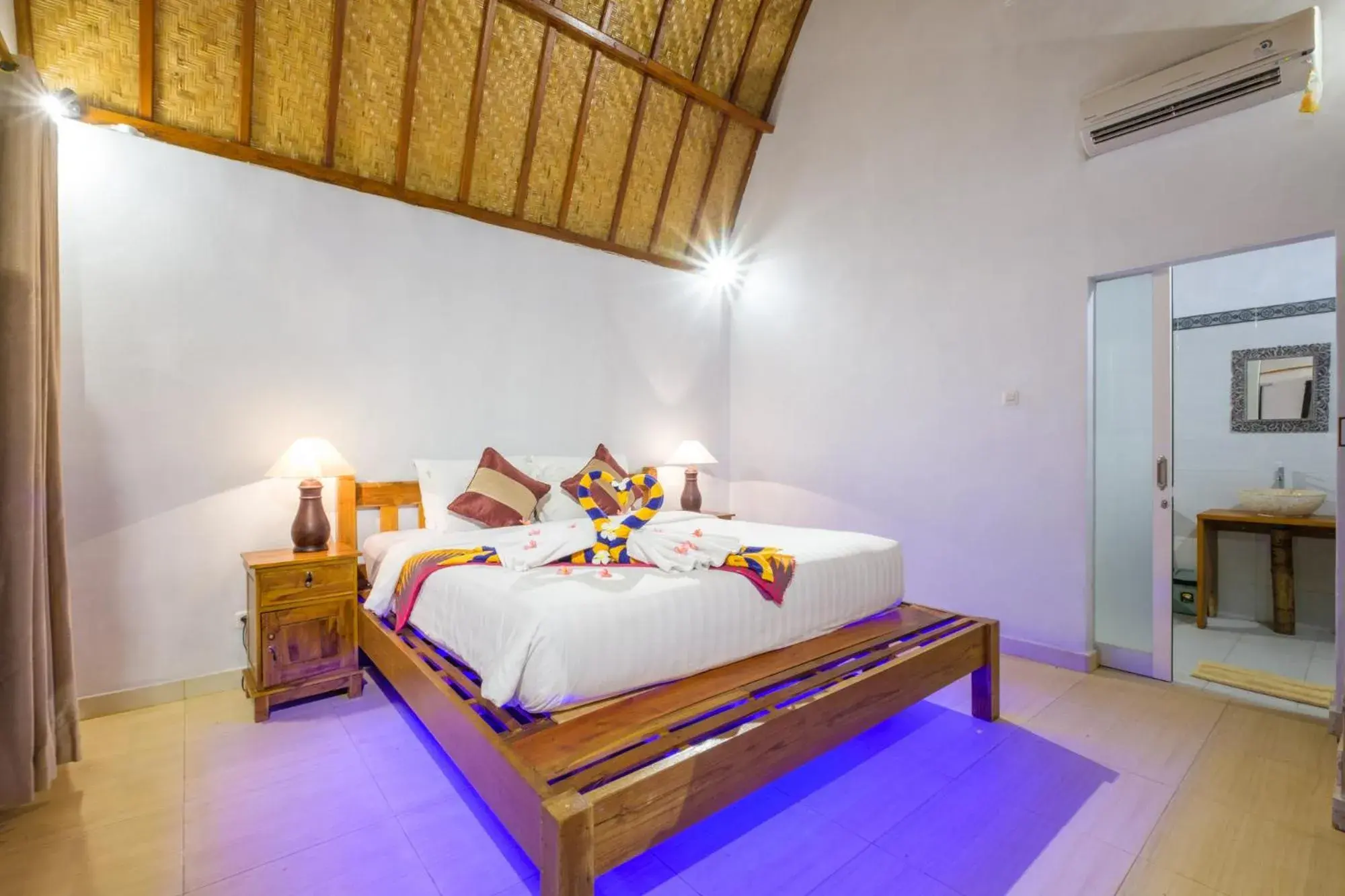 Bed in Crystal Bay Bungalows Bed in Crystal Bay Bungalows