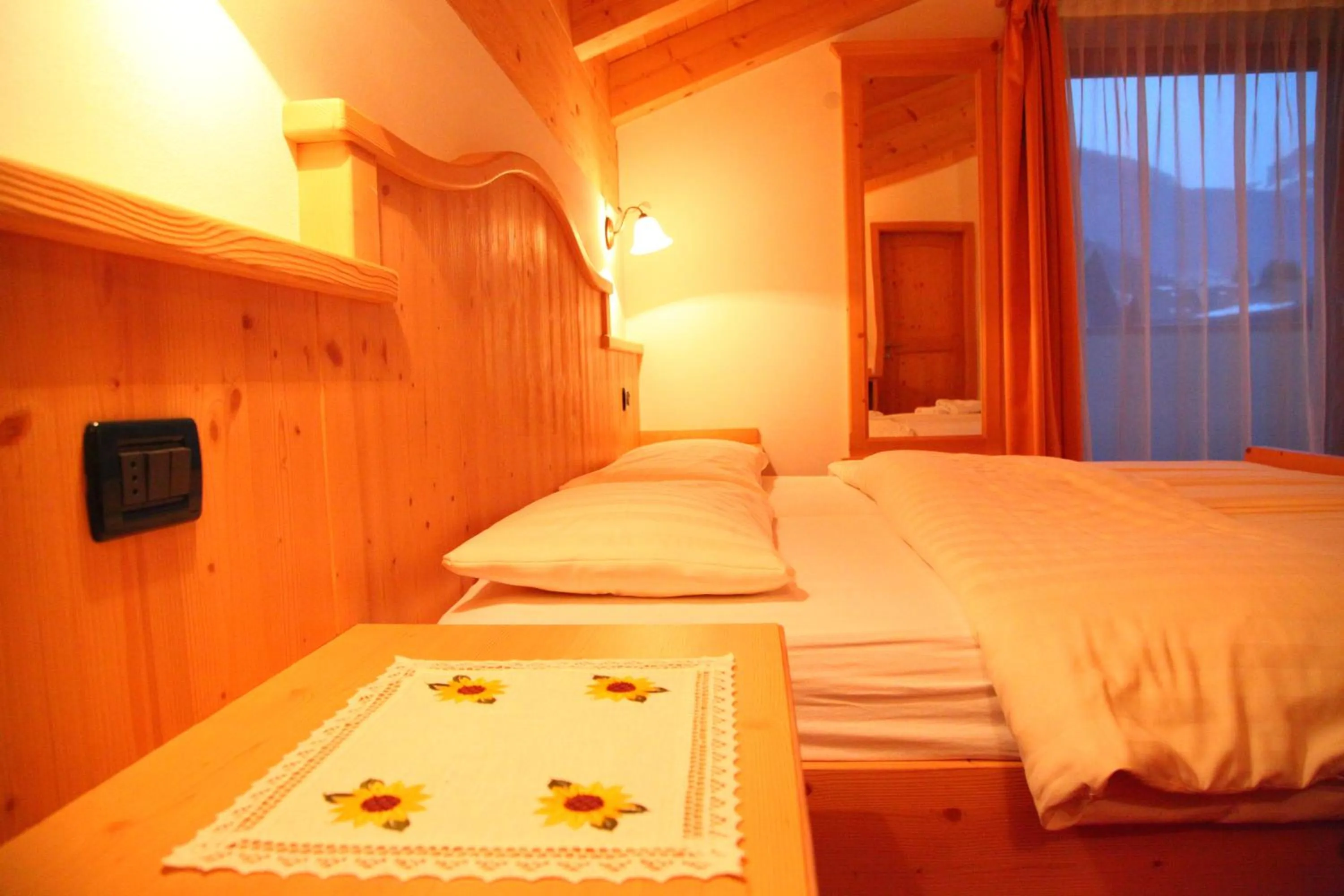 Bed in Garnì Prà Fiorì