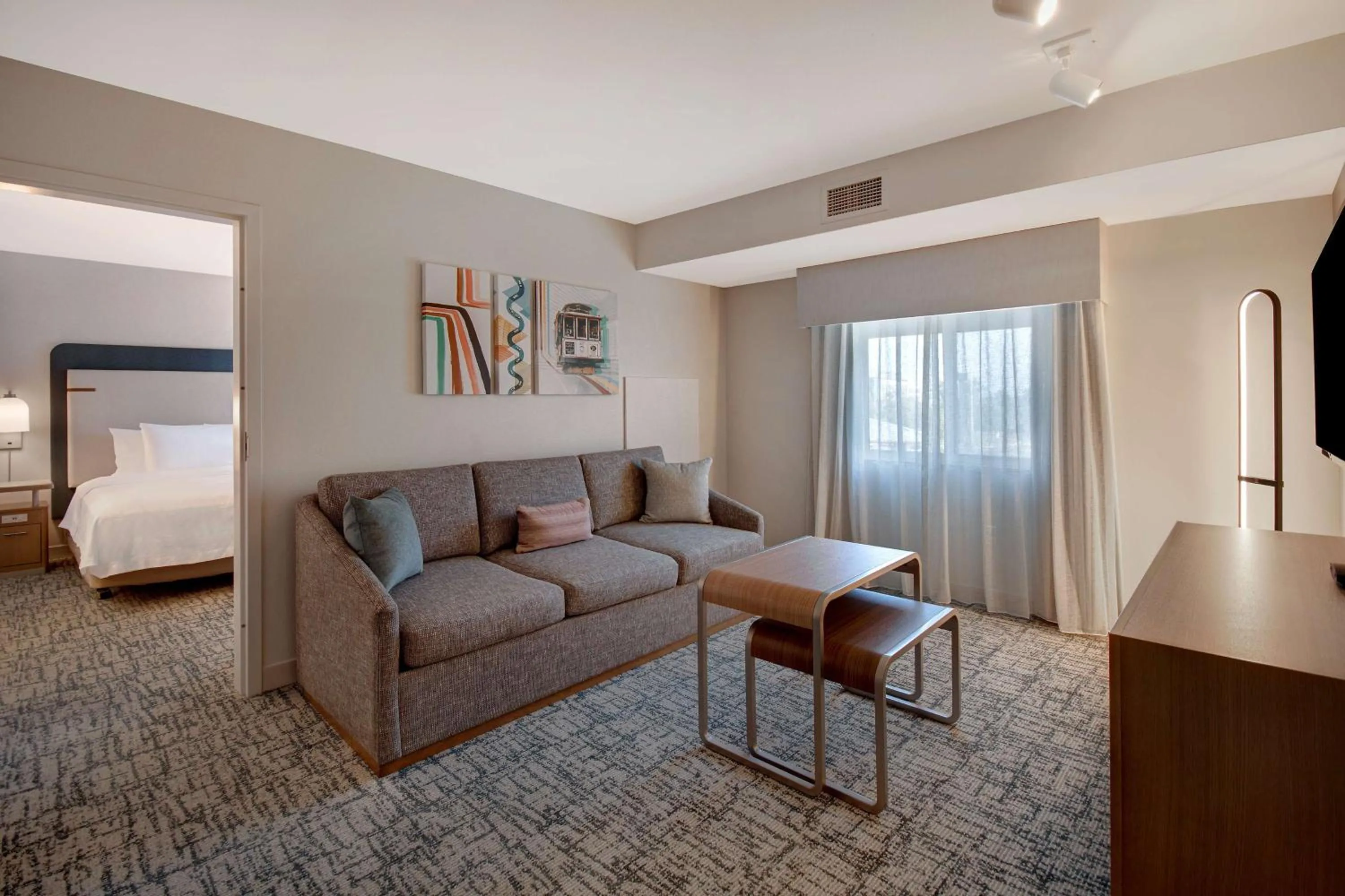 Living room, Bed in Homewood Suites by Hilton San Francisco Airport North California