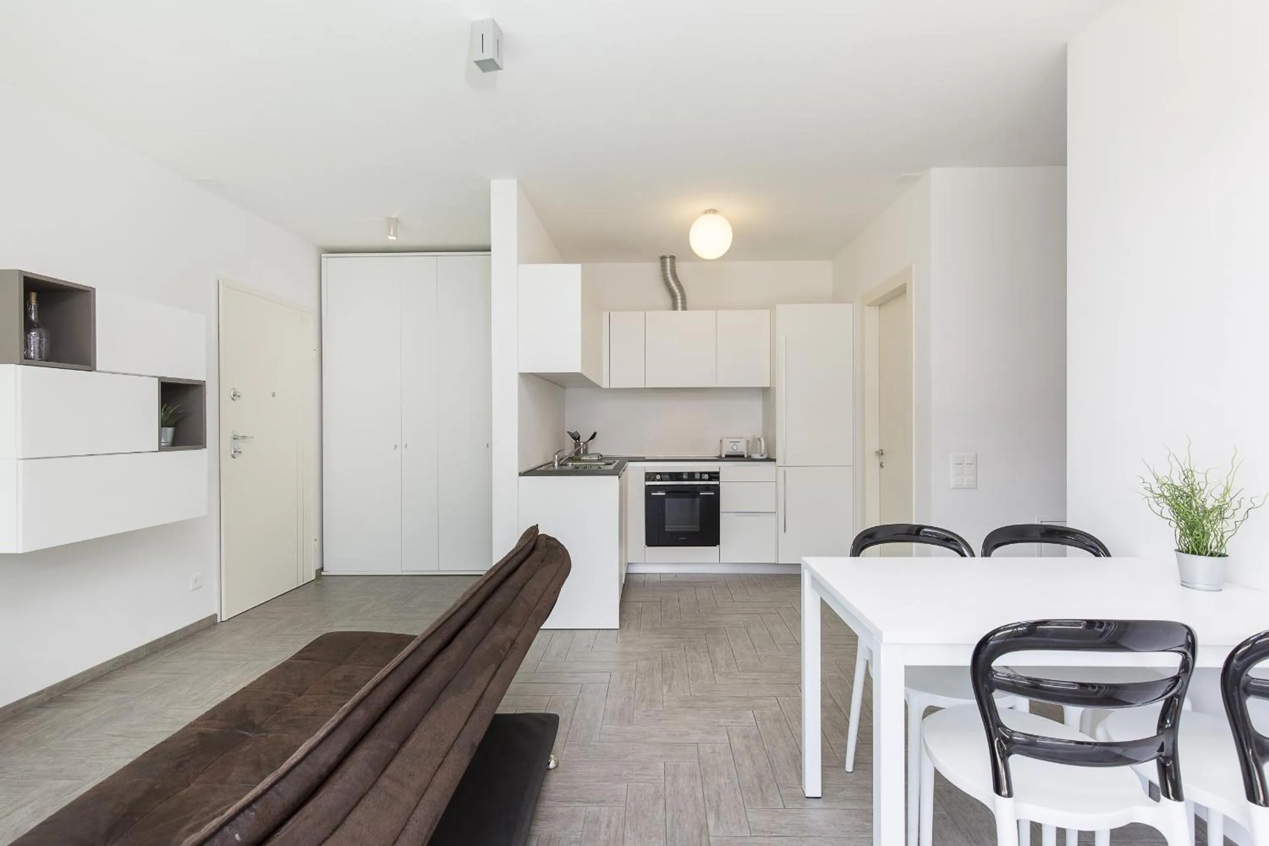 Kitchen or kitchenette in Roggia Apartments by Quokka 360 - central flats with parking space