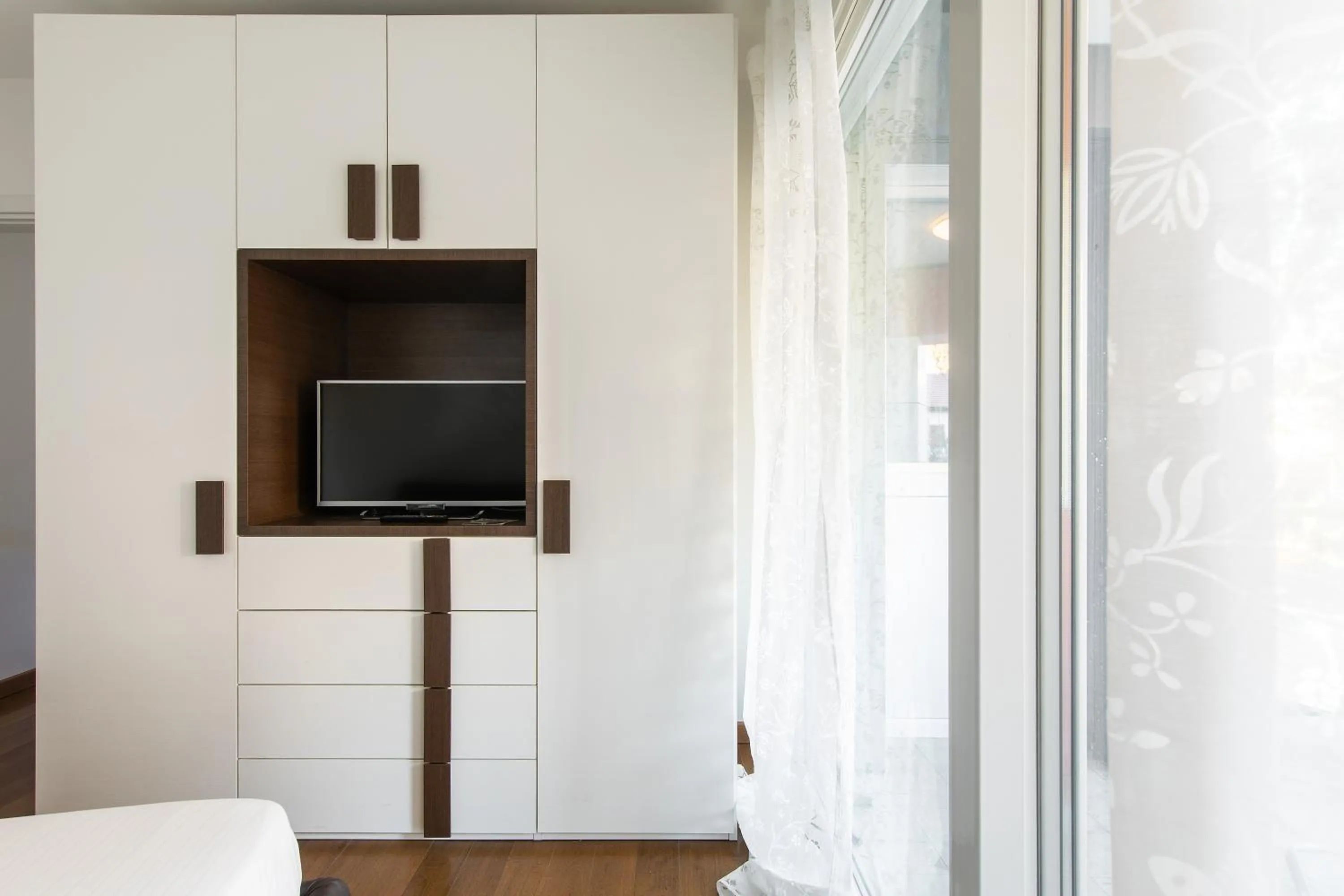 TV and multimedia in Roggia Apartments by Quokka 360 - central flats with parking space