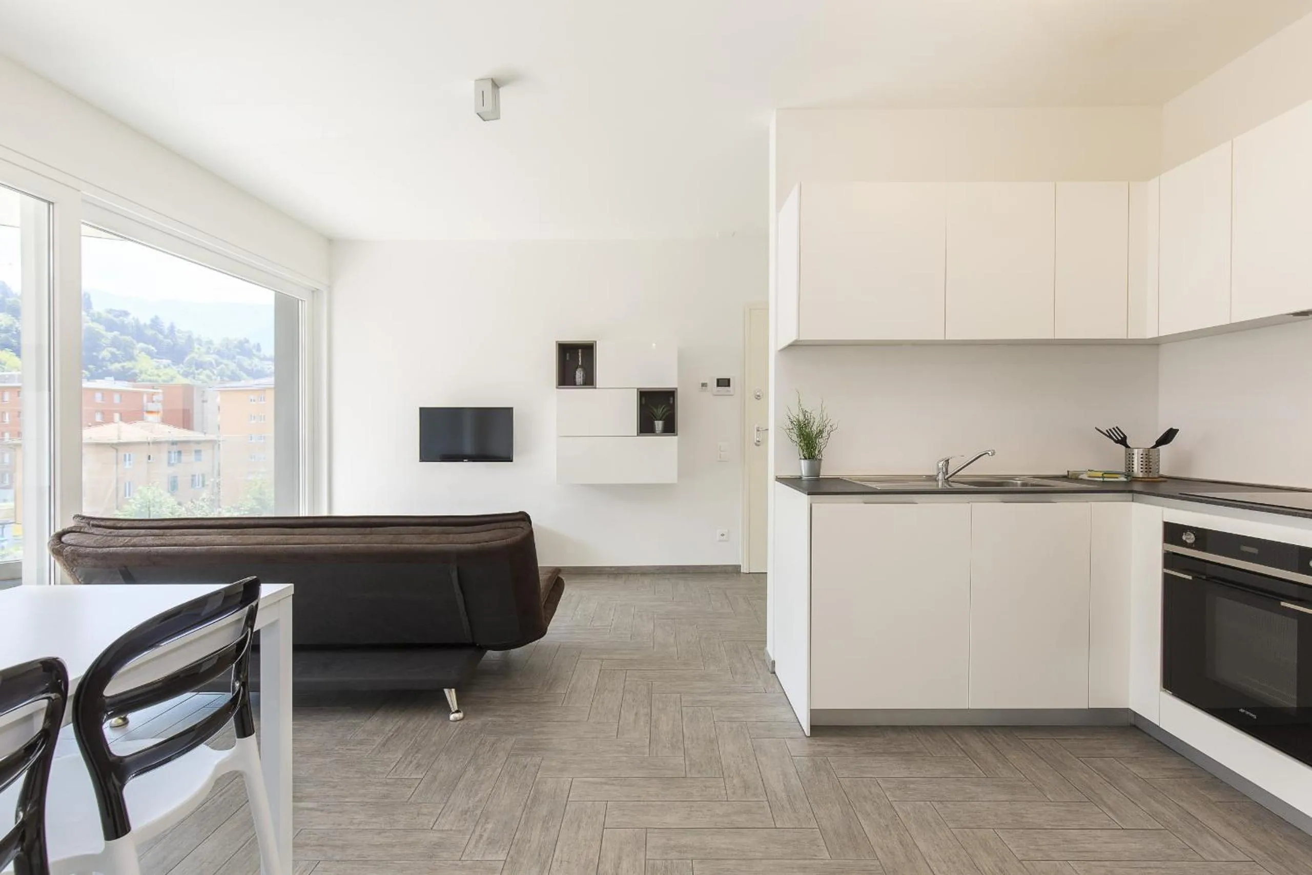 Kitchen or kitchenette in Roggia Apartments by Quokka 360 - central flats with parking space
