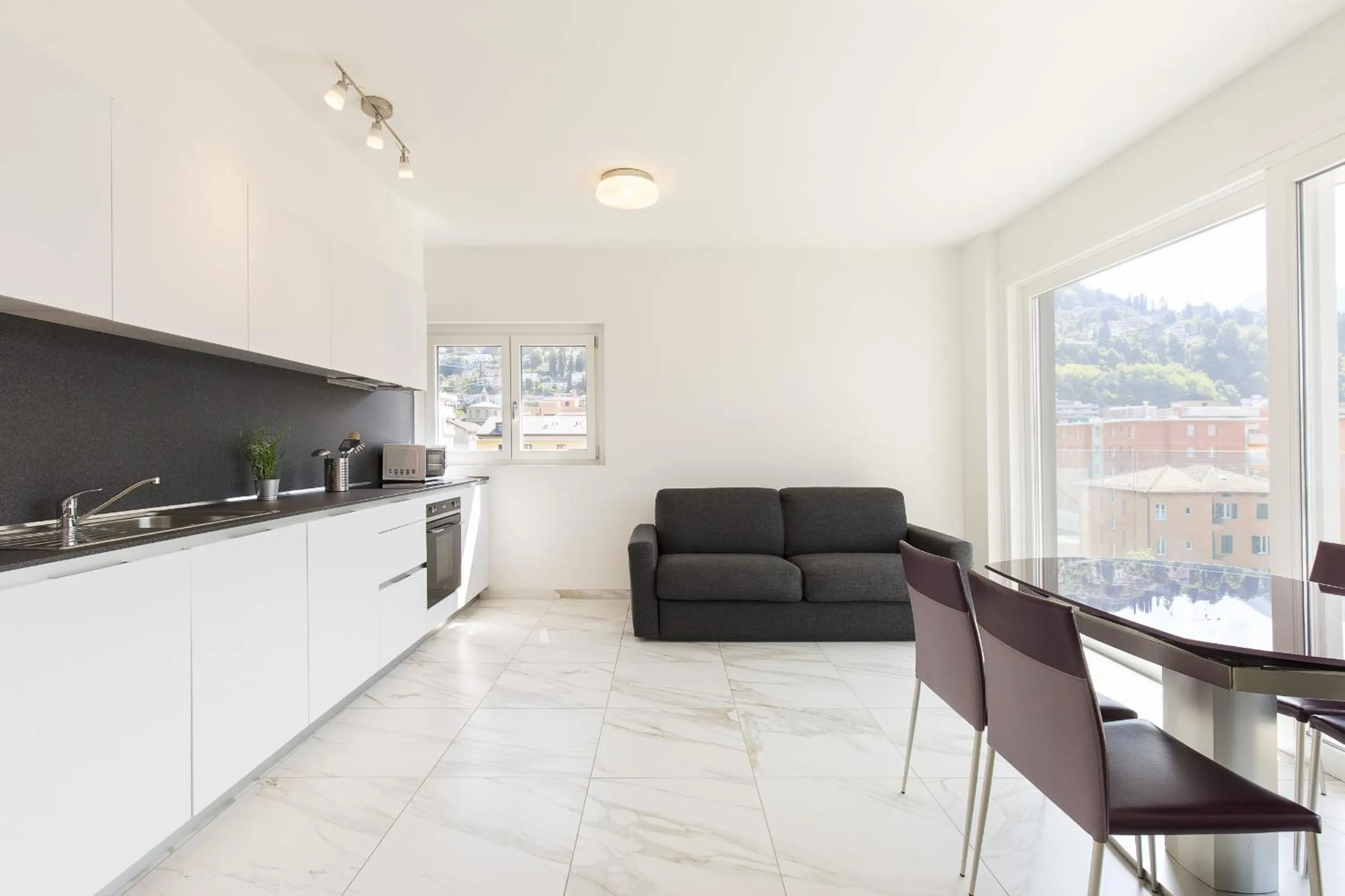 Kitchen or kitchenette in Roggia Apartments by Quokka 360 - central flats with parking space