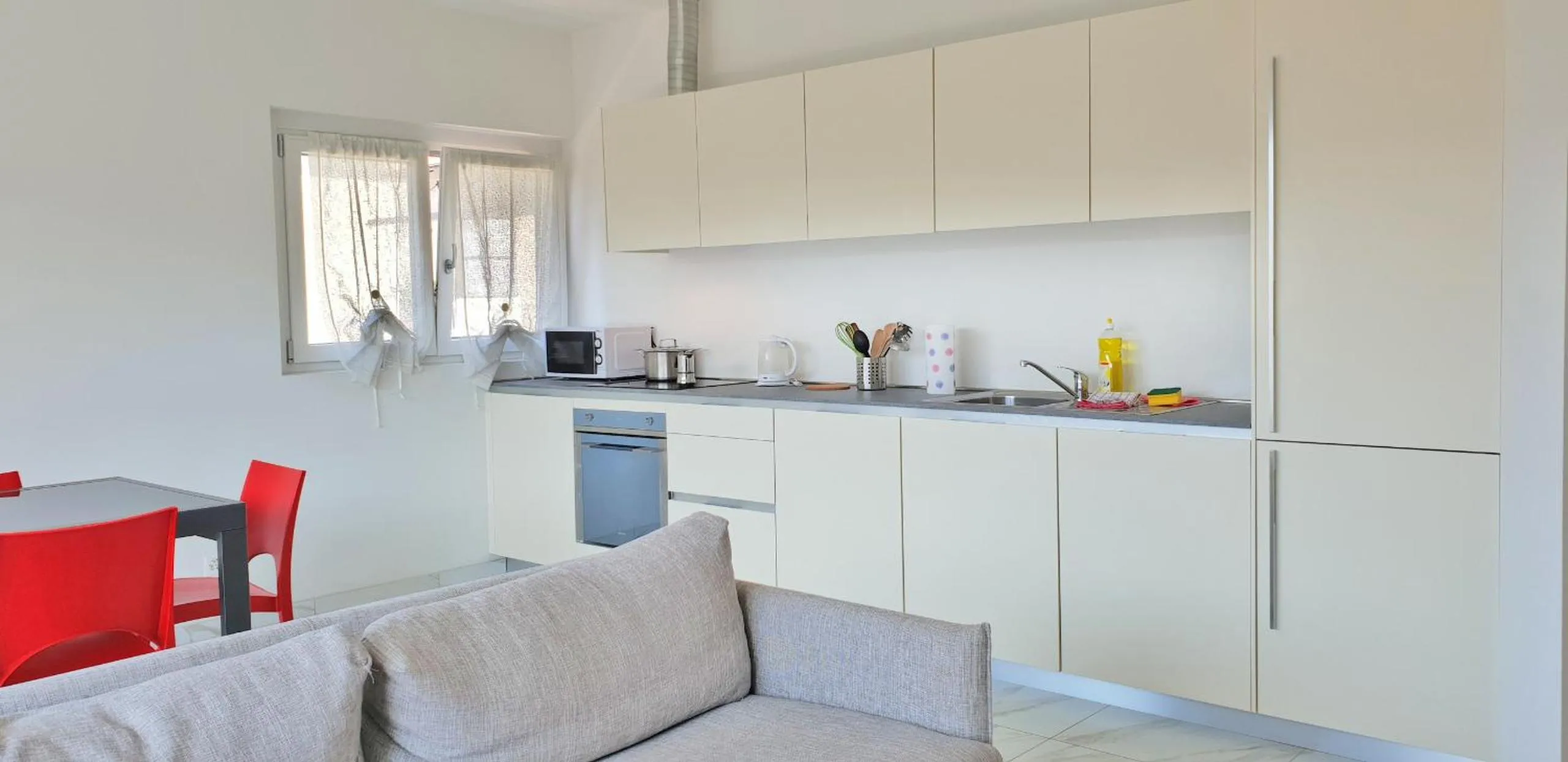 Kitchen or kitchenette in Roggia Apartments by Quokka 360 - central flats with parking space
