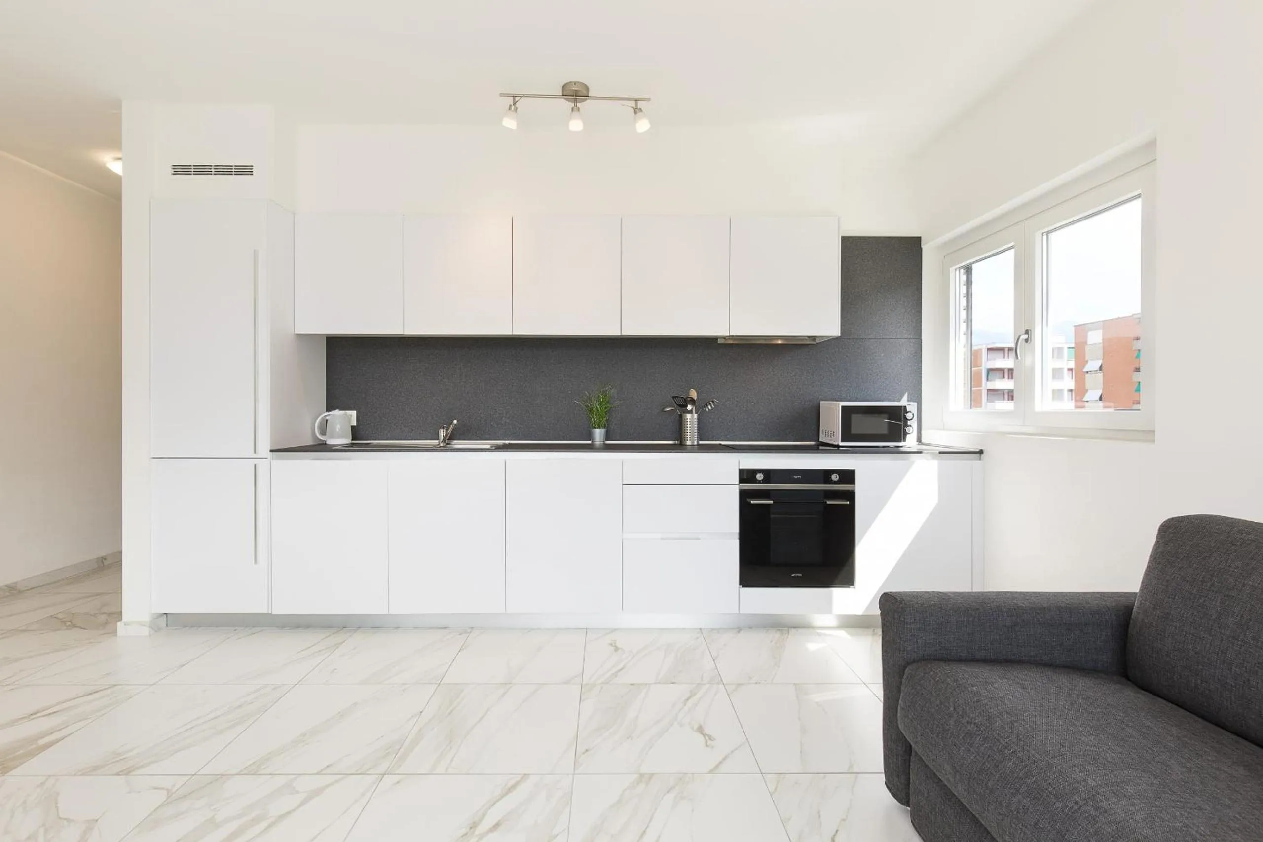 Kitchen or kitchenette in Roggia Apartments by Quokka 360 - central flats with parking space