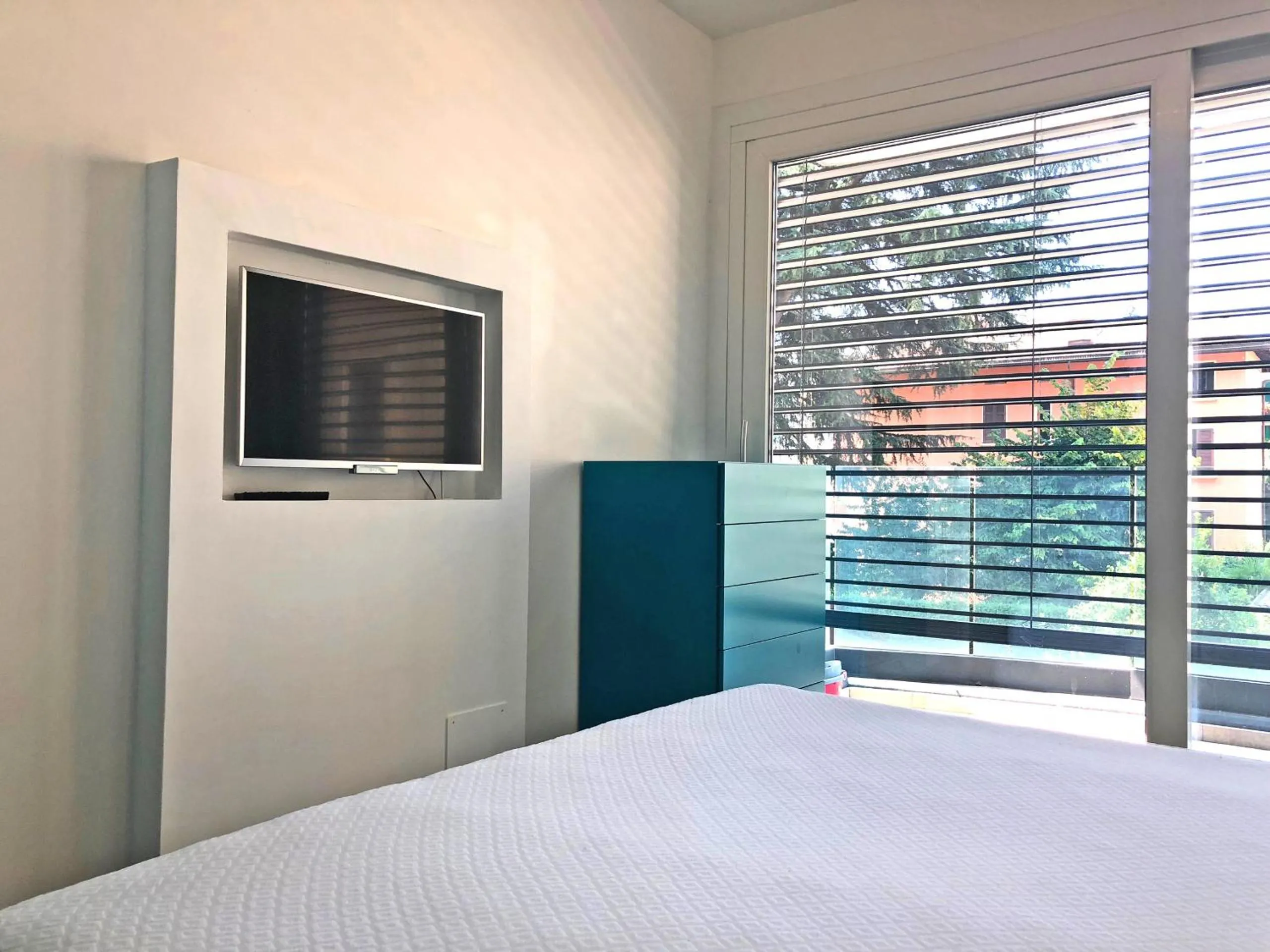TV and multimedia, Bed in Roggia Apartments by Quokka 360 - central flats with parking space