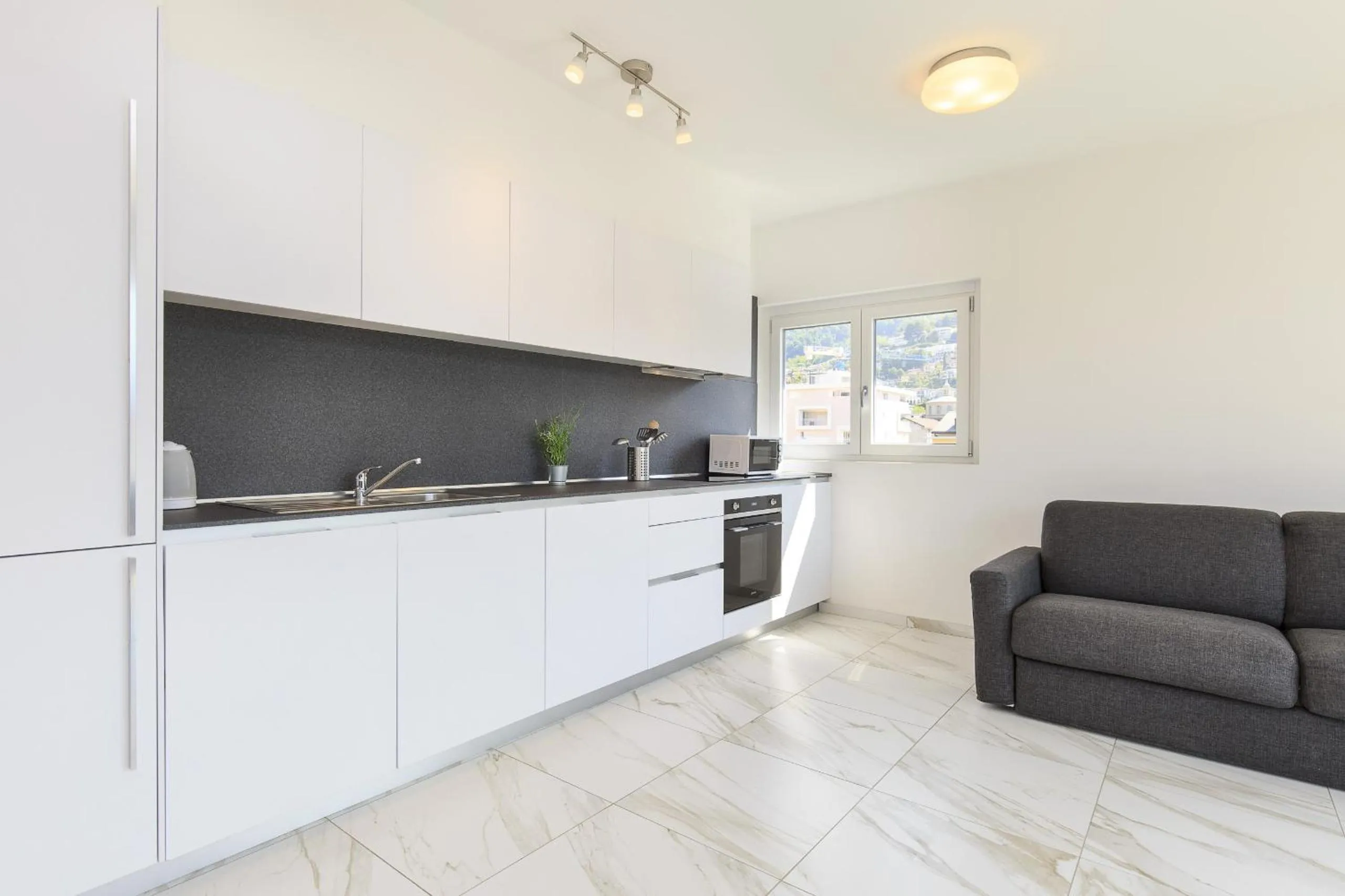 Kitchen or kitchenette in Roggia Apartments by Quokka 360 - central flats with parking space
