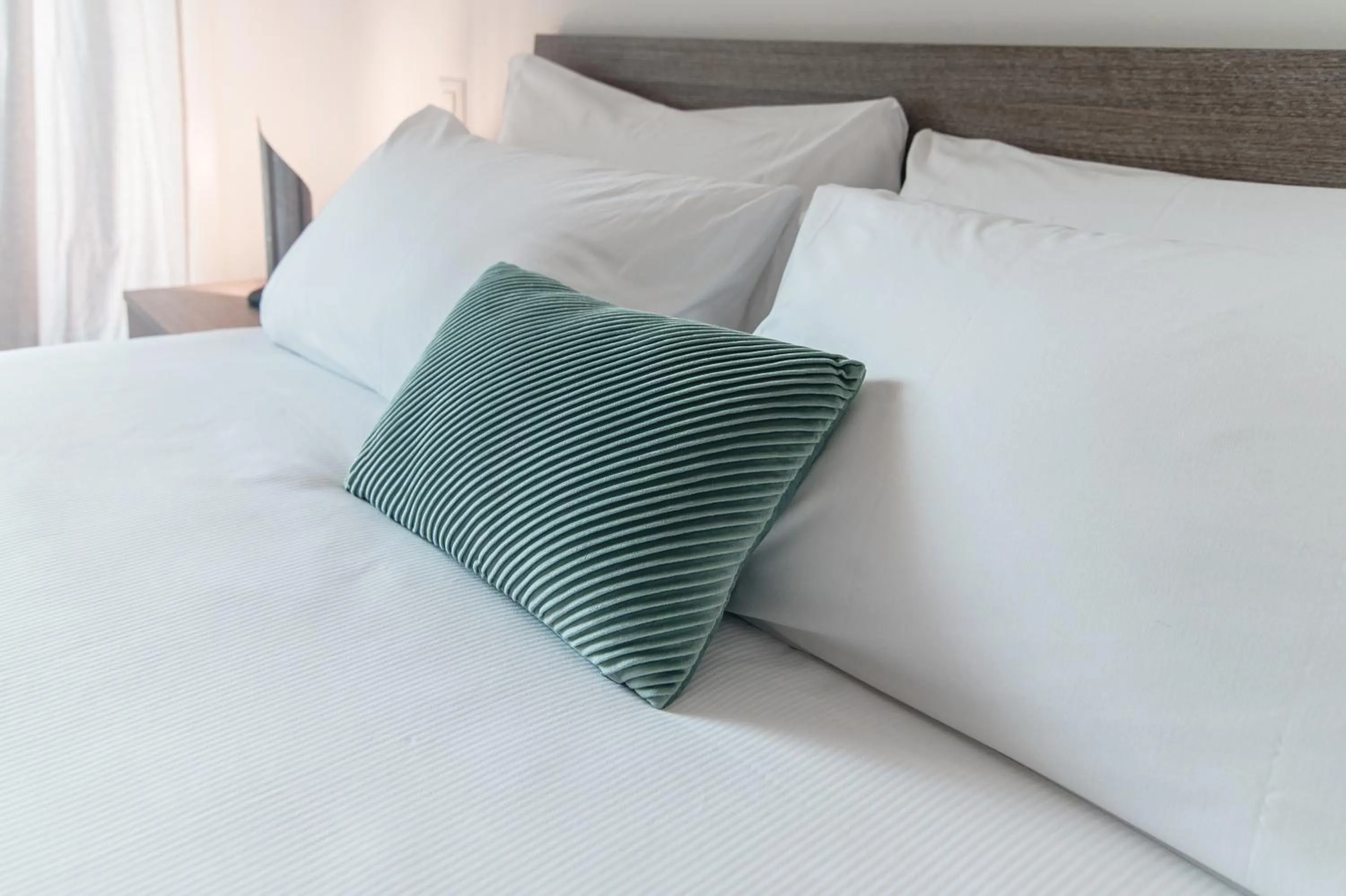 Bed in Roggia Apartments by Quokka 360 - central flats with parking space