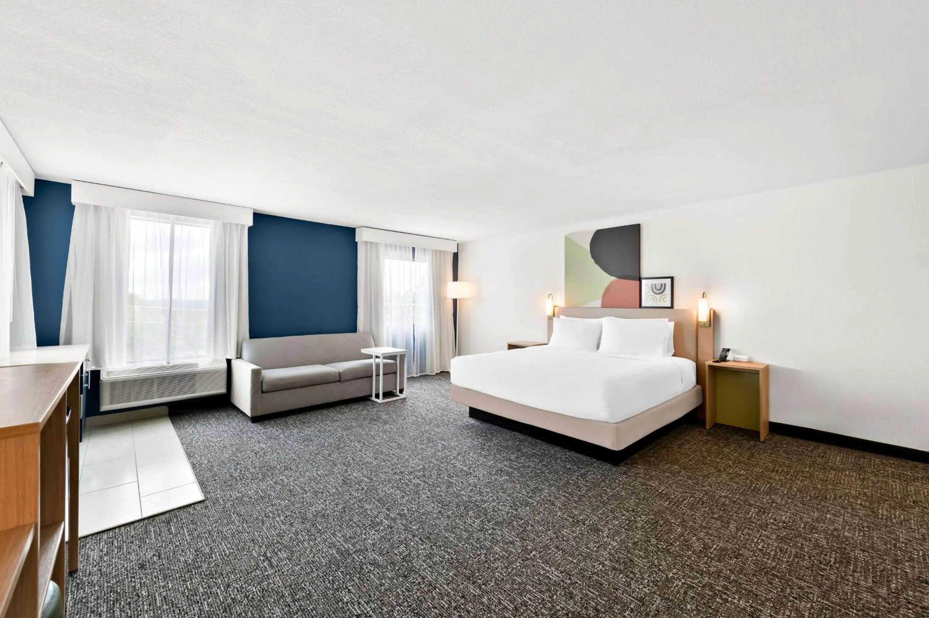 Living room, Bed in Barrington Hotel & Suites