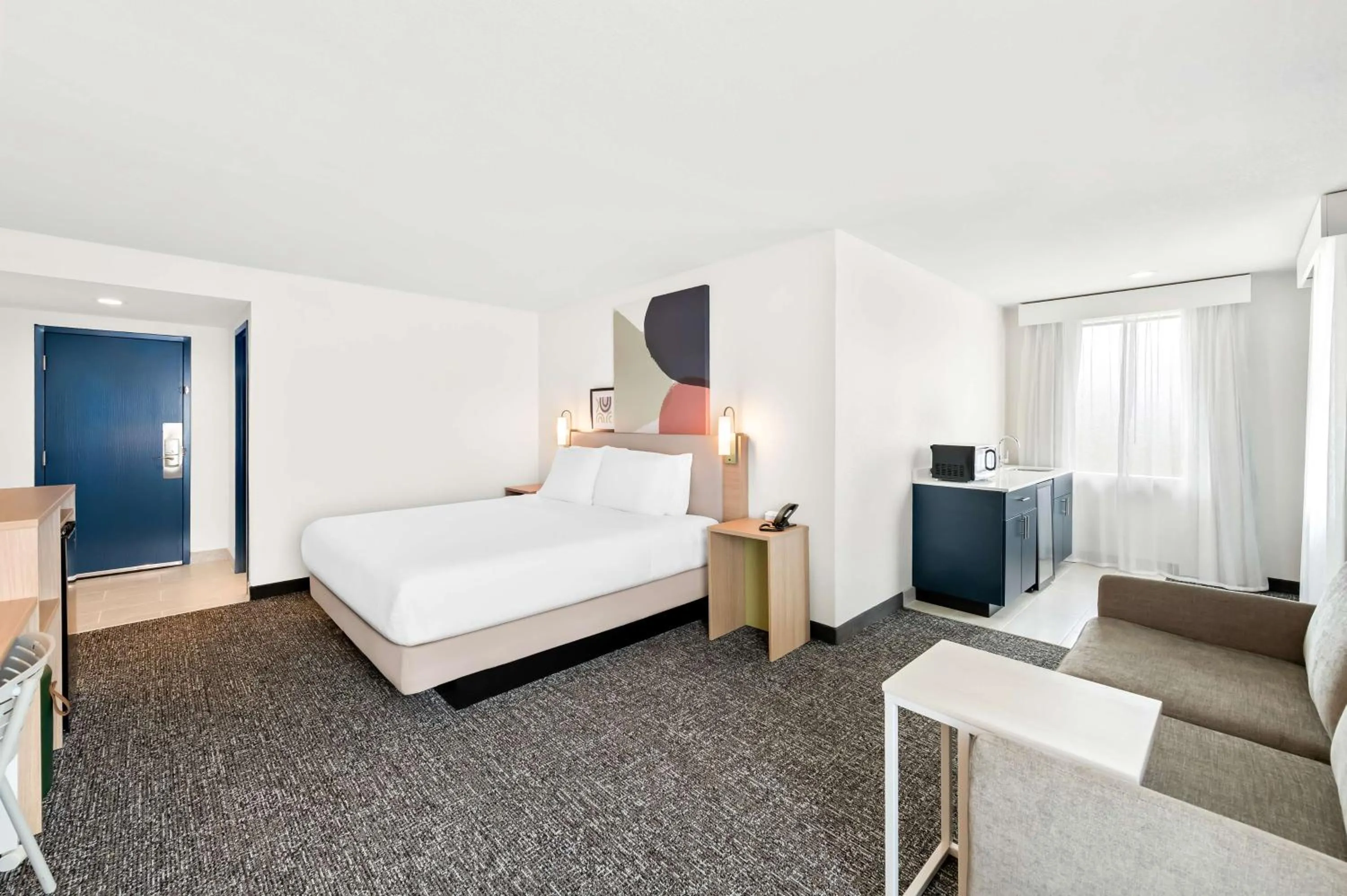 Living room, Bed in Barrington Hotel & Suites