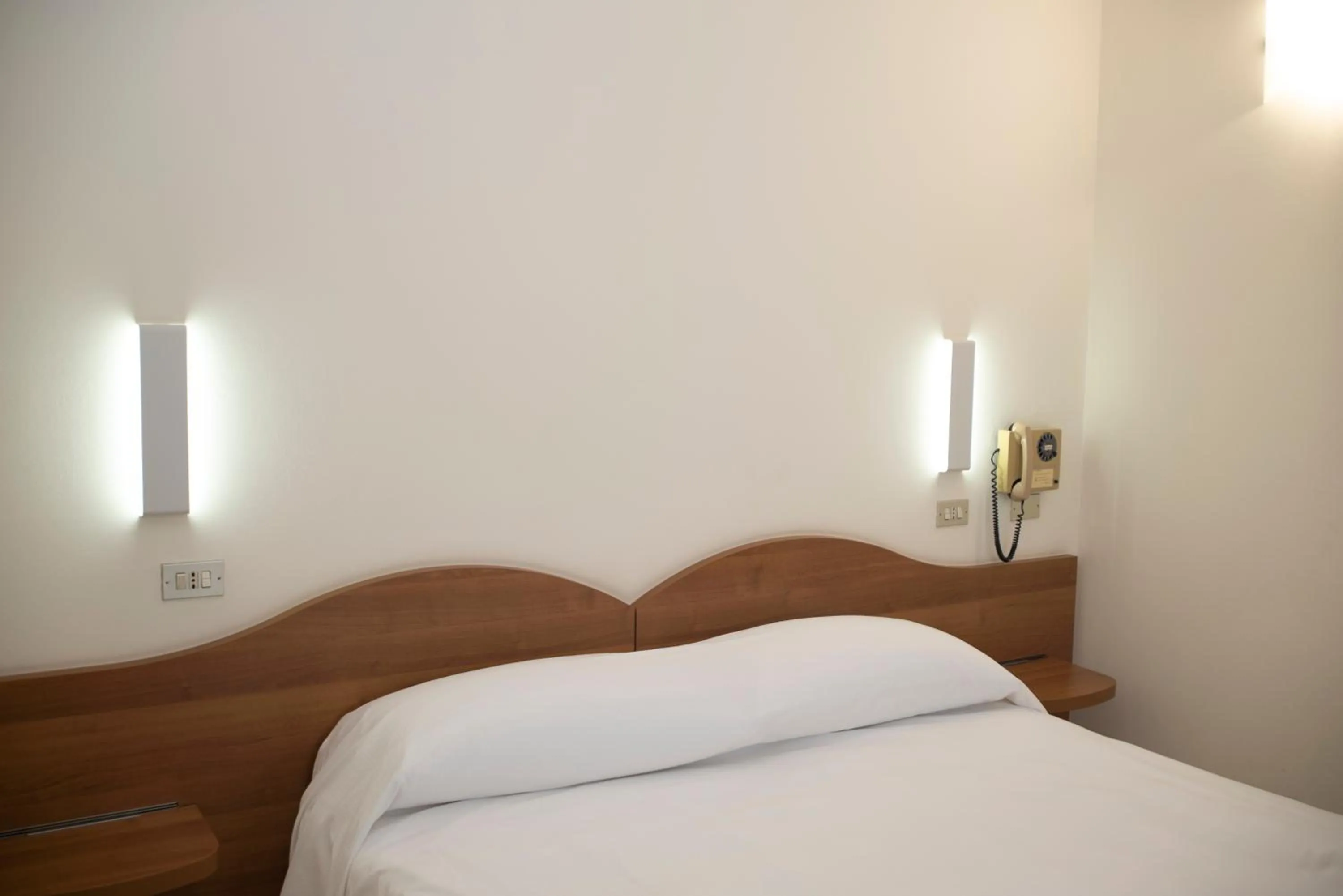 Bed in Albergo Aurora
