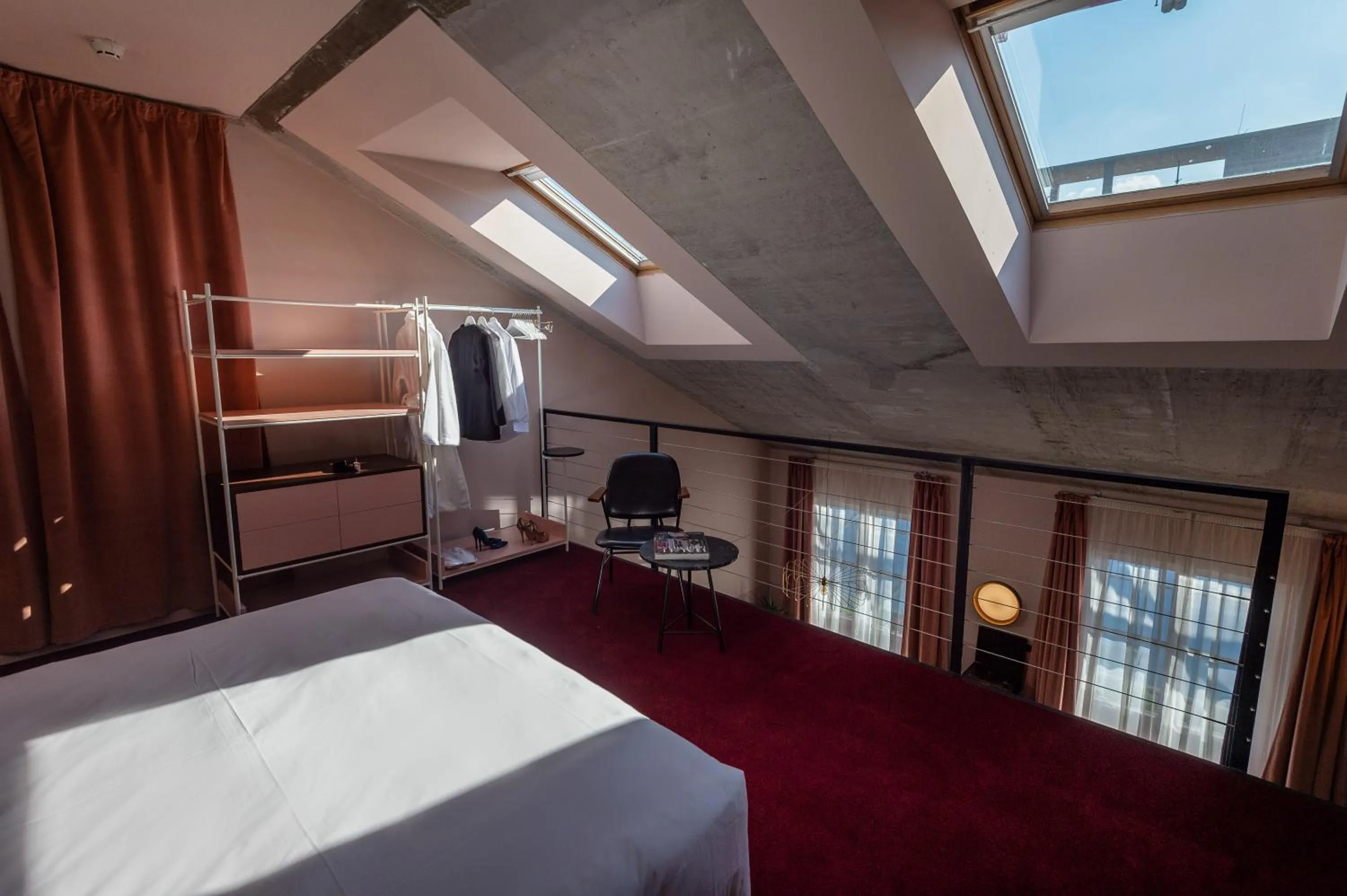 Seating area, Bed in Stories Boutique Hotel