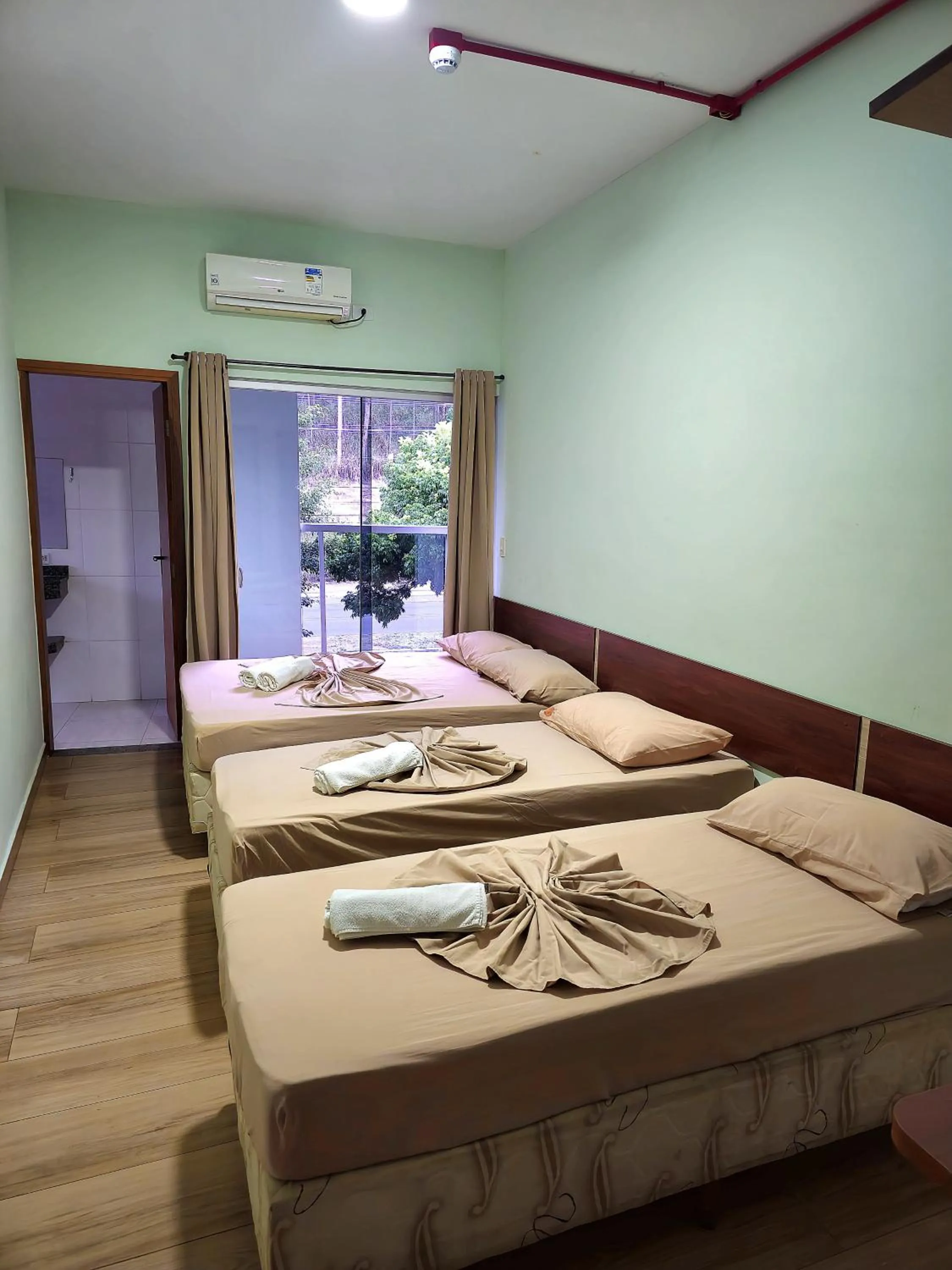 Property building, Bed in Pousada Monte Oliveira
