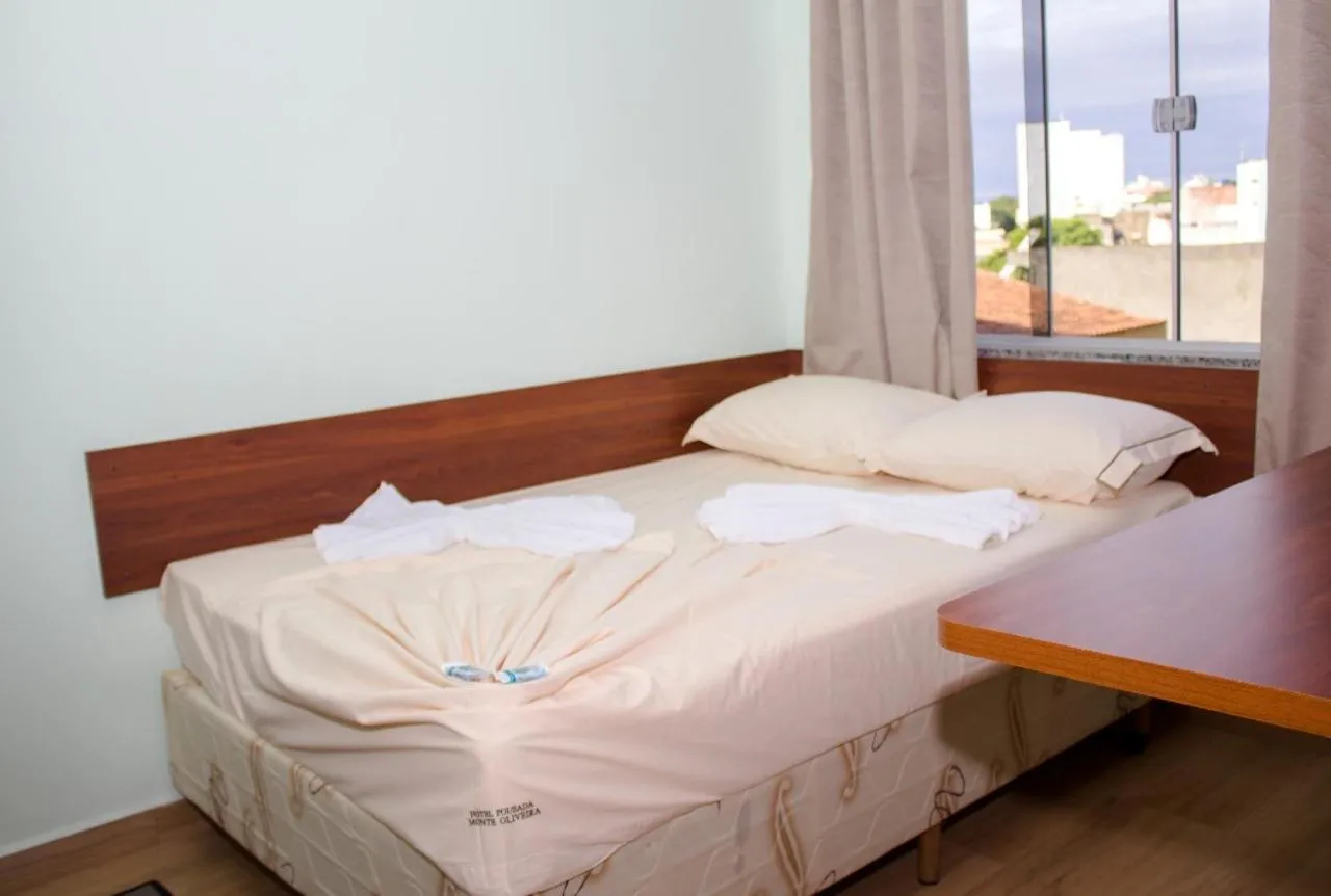 Bed in Pousada Monte Oliveira