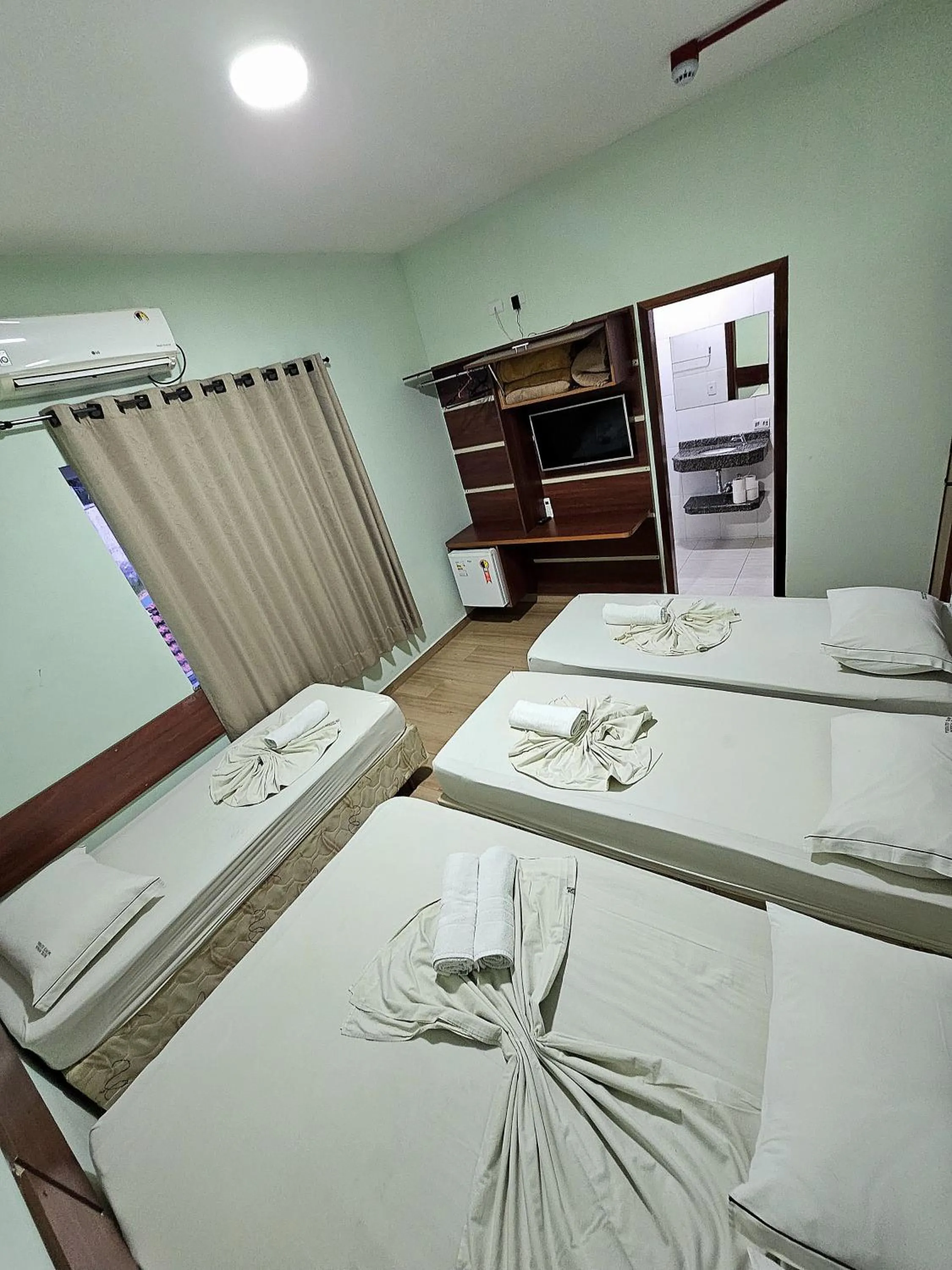Bed in Pousada Monte Oliveira