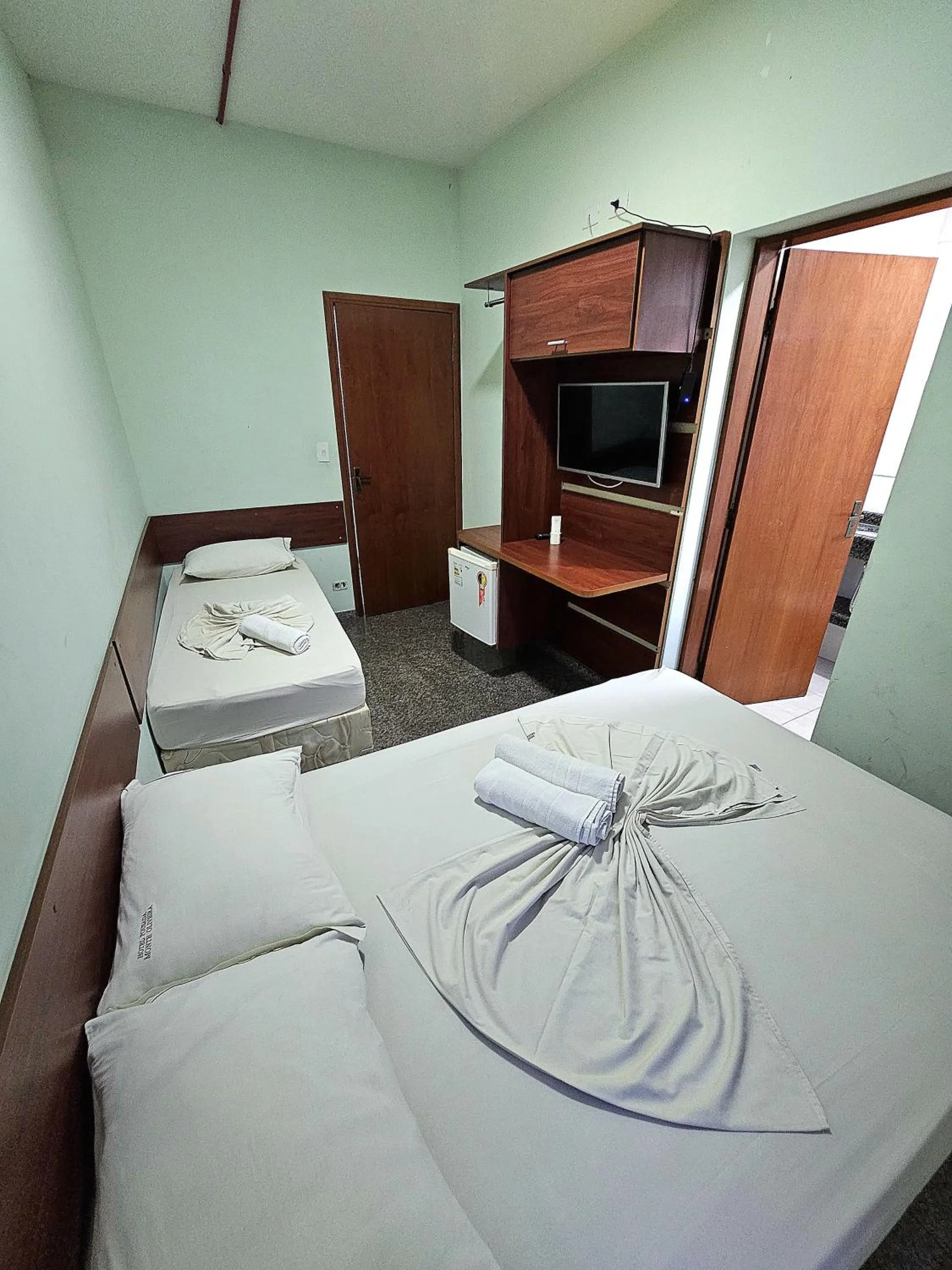 Bed in Pousada Monte Oliveira