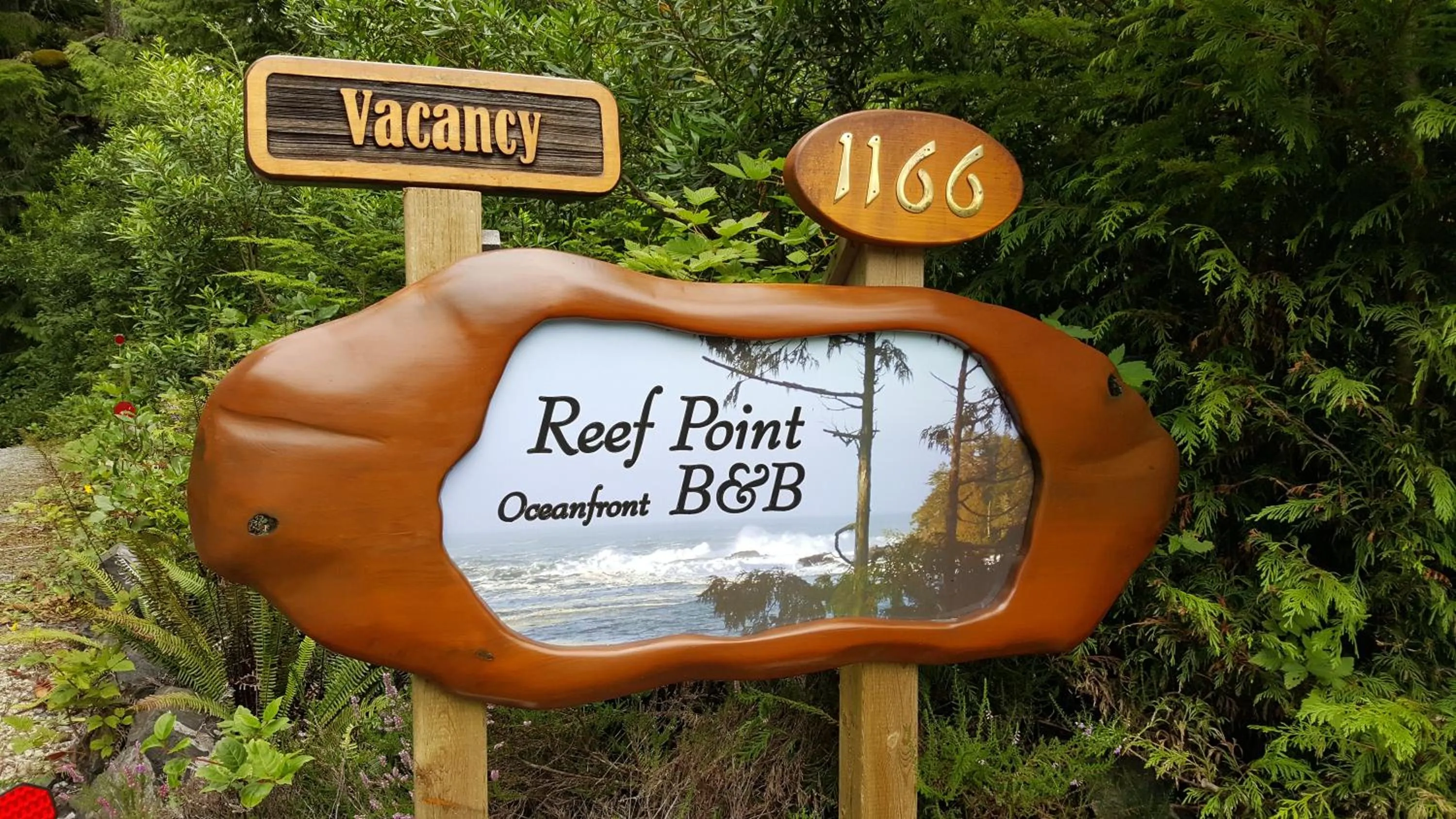 Property logo or sign in Reef Point Oceanfront Bed and Breakfast