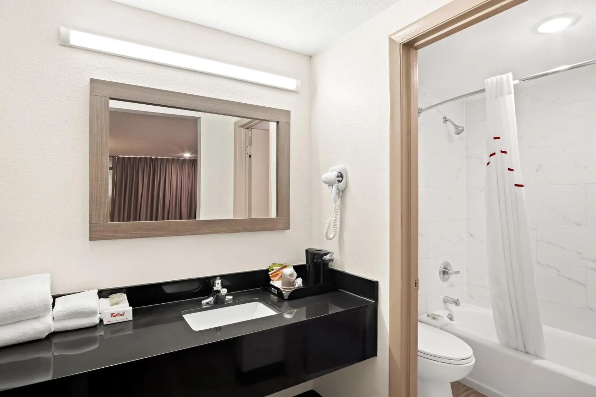 Bathroom in Red Roof Inn & Conference Center McKinney