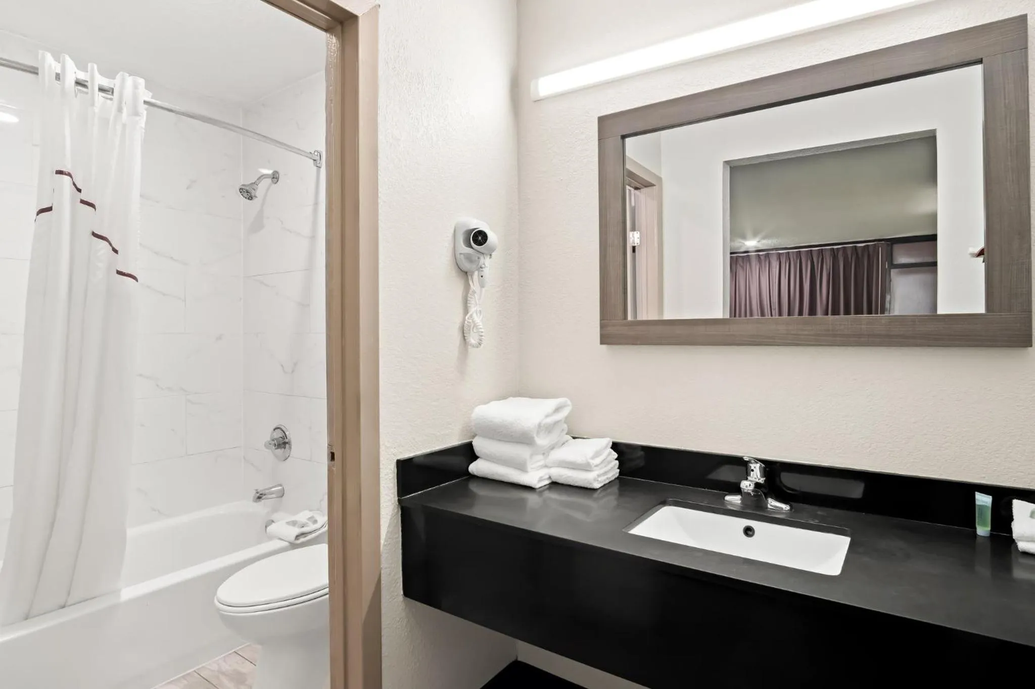 Bathroom in Red Roof Inn & Conference Center McKinney