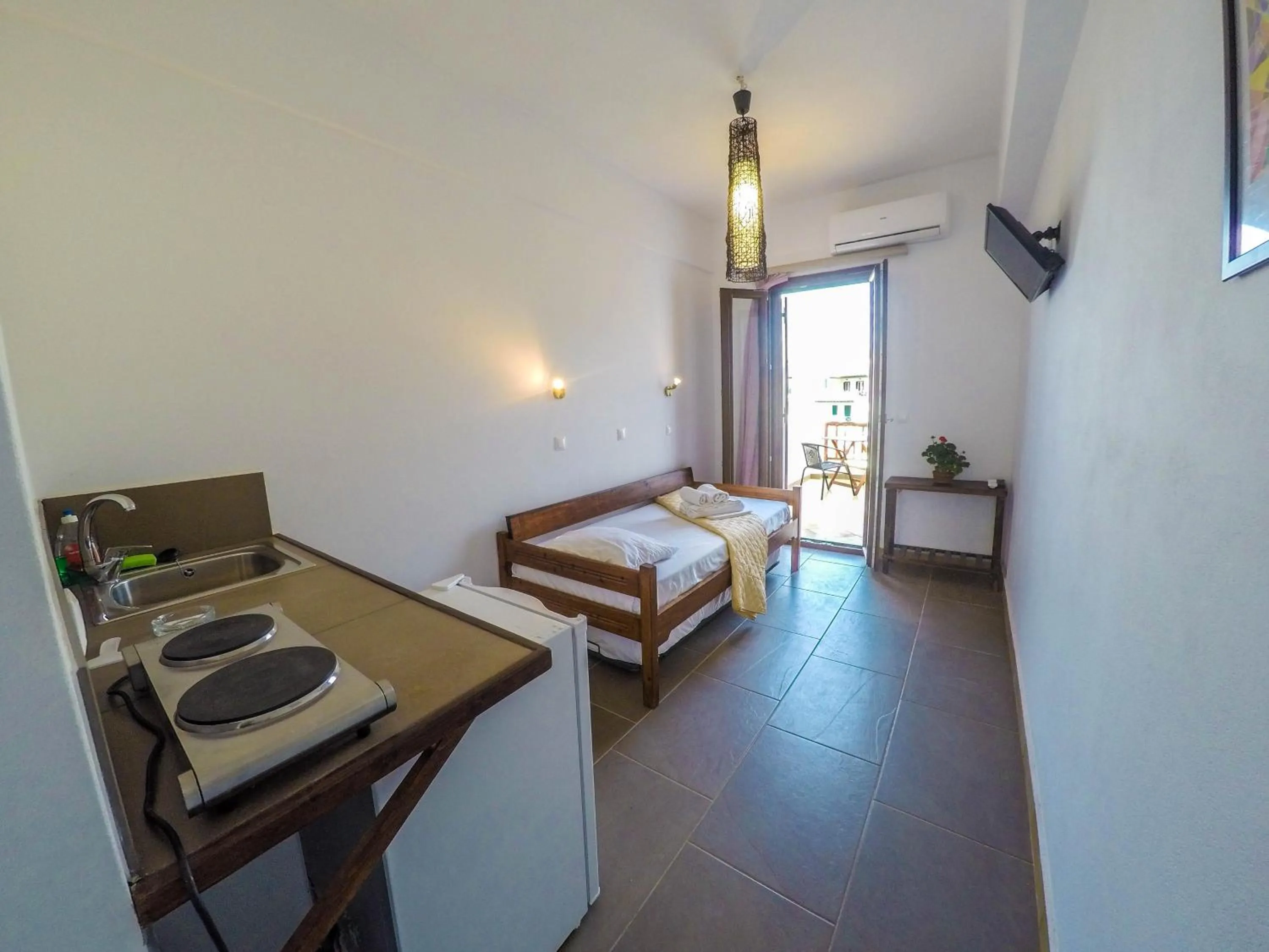 Photo of the whole room, Bed in Amorani Studios