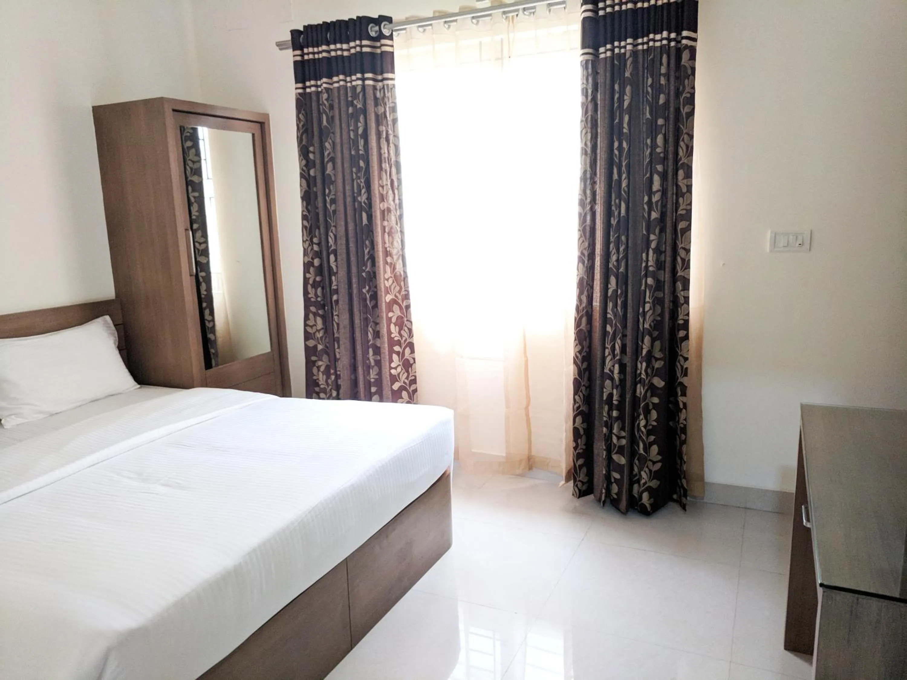 Bed in Clyford Suites