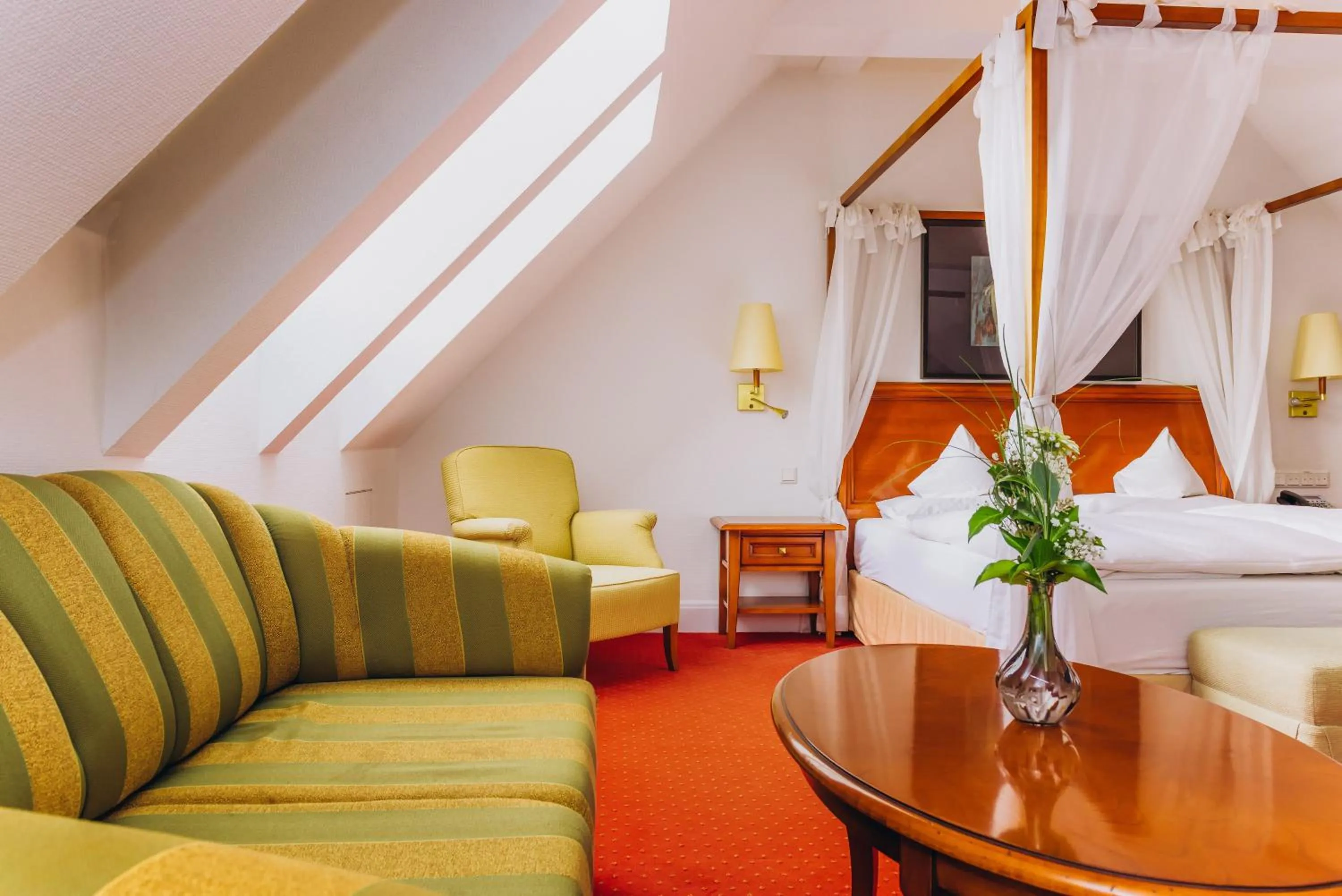 Seating area, Bed in Hotel Moosburger Hof