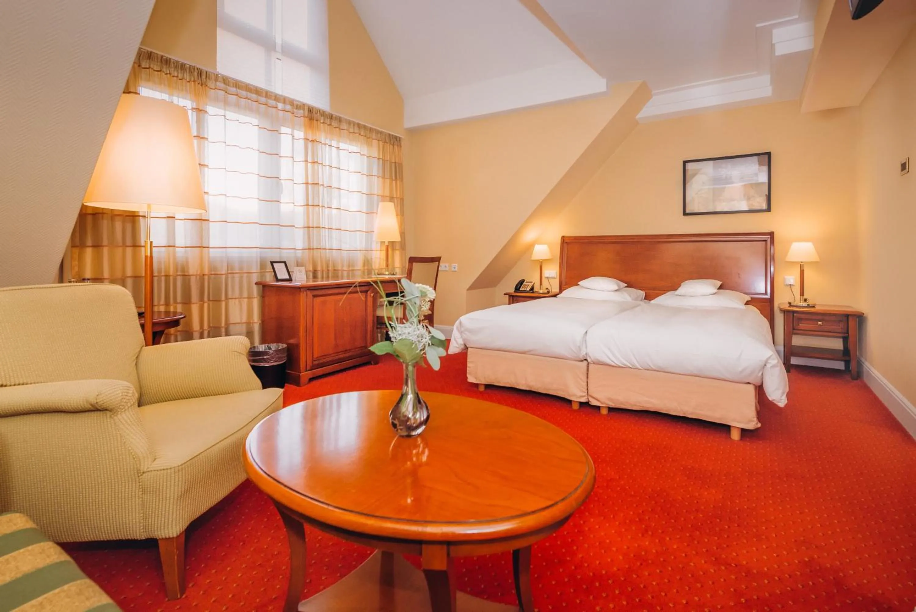 Seating area, Bed in Hotel Moosburger Hof