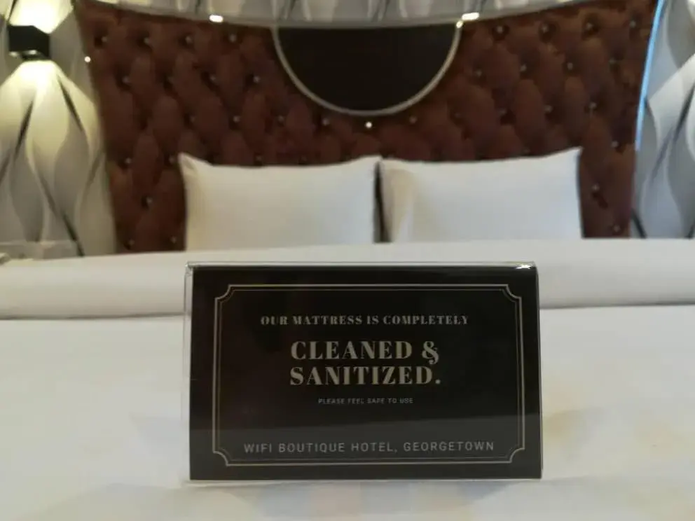 Property logo or sign, Bed in Wifi Boutique Hotel Property logo or sign, Bed in Wifi Boutique Hotel