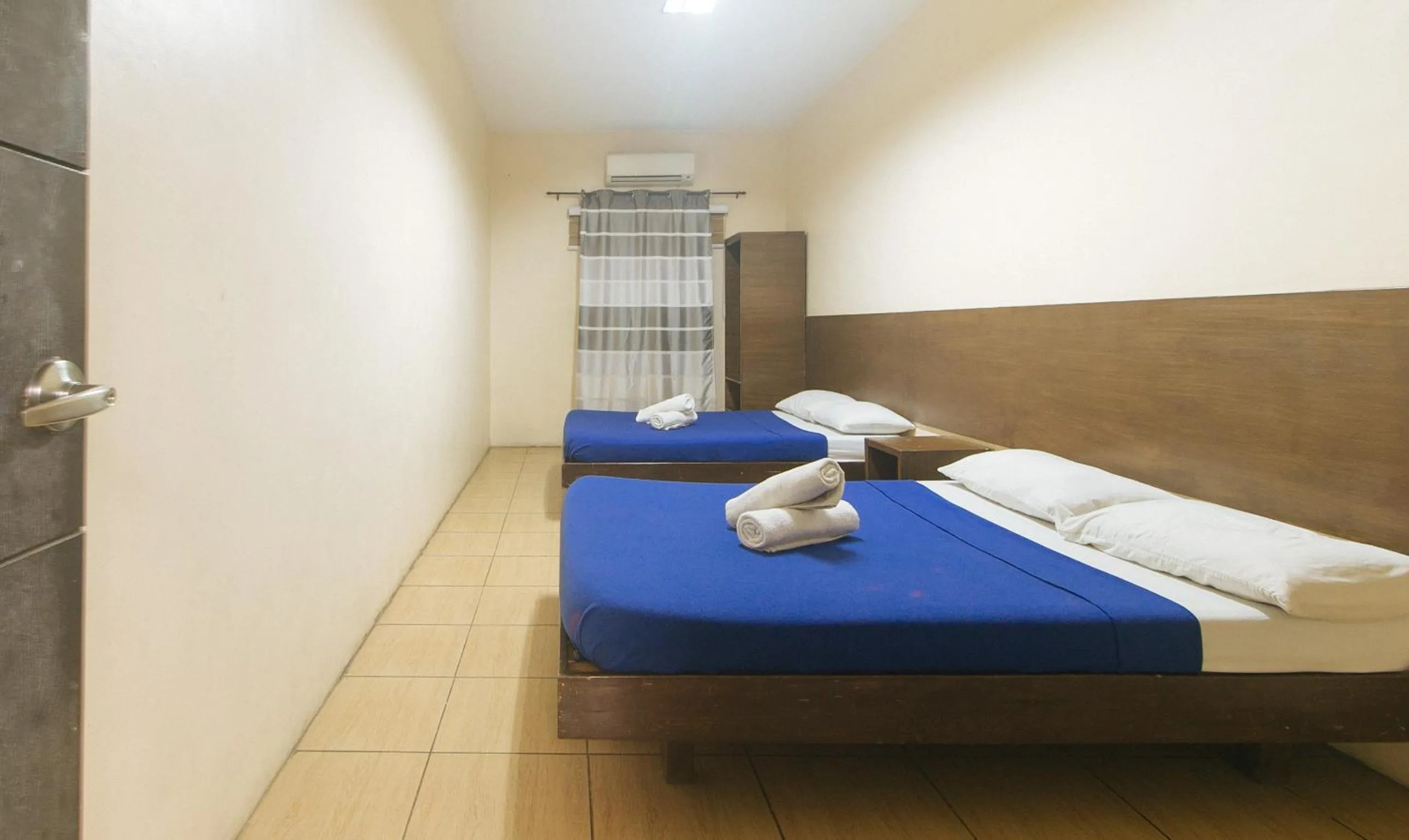 Bed in Metro Deluxe Residences near World Trade Center