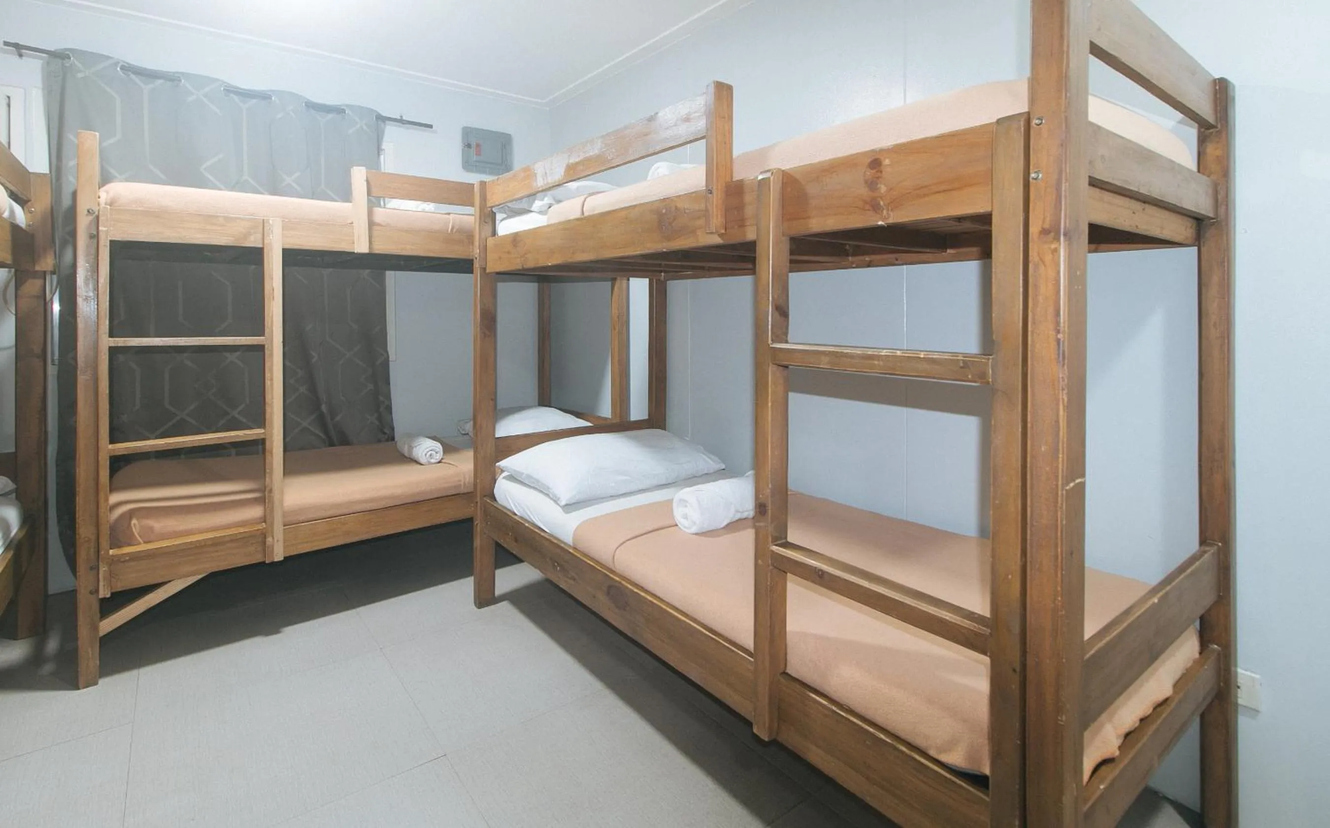 Bed in Metro Deluxe Residences near World Trade Center