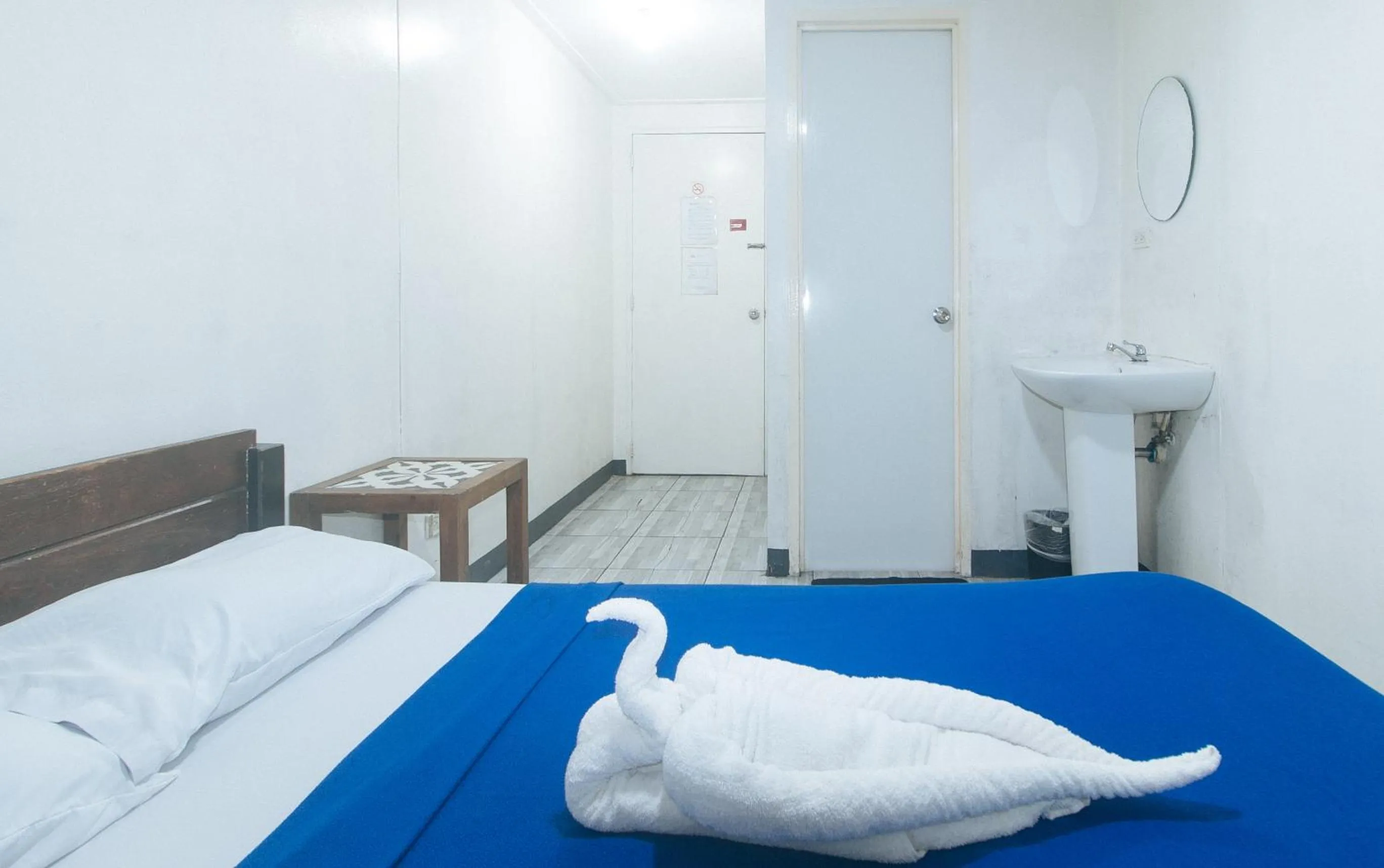 Bed in Metro Deluxe Residences near World Trade Center