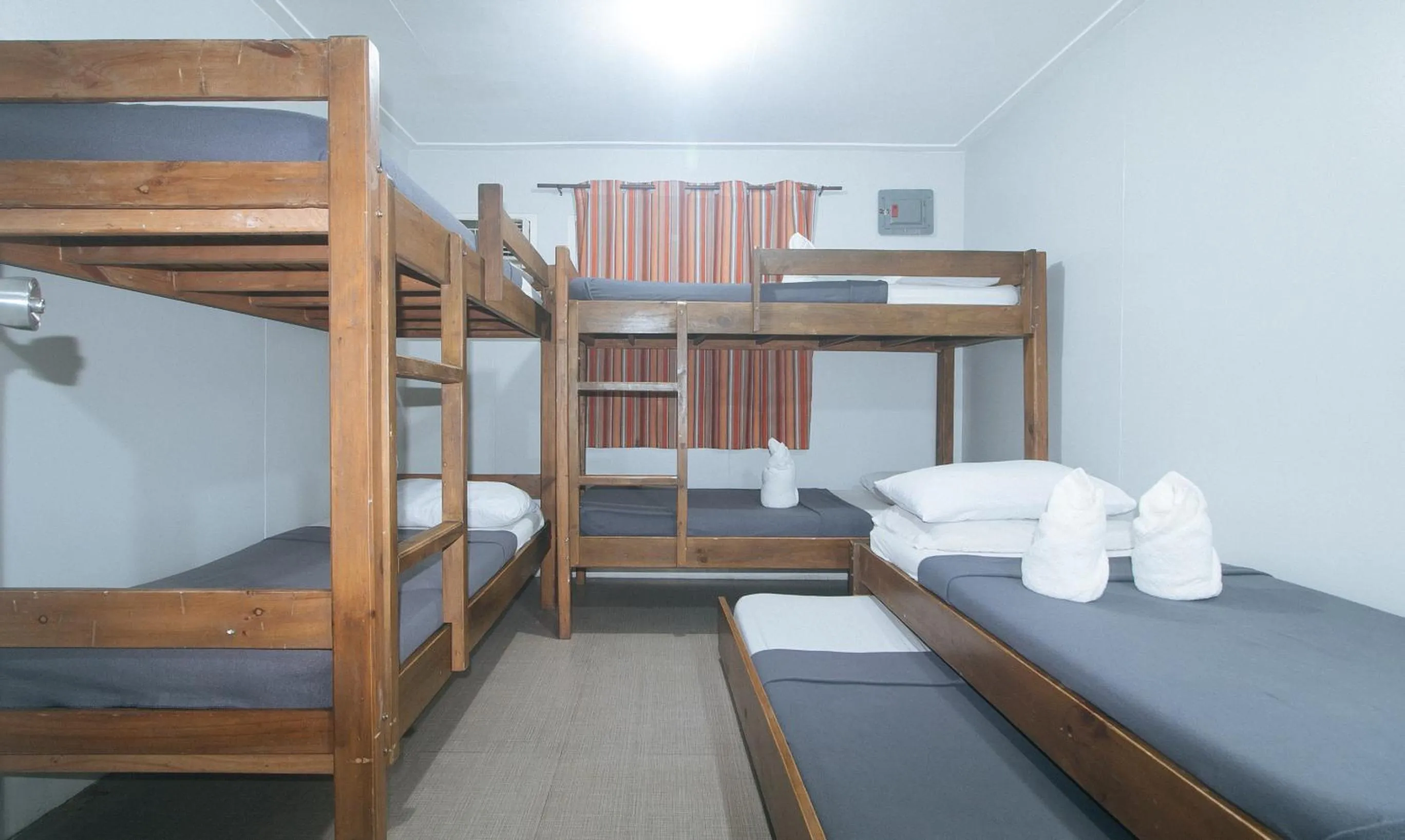 Bed in Metro Deluxe Residences near World Trade Center